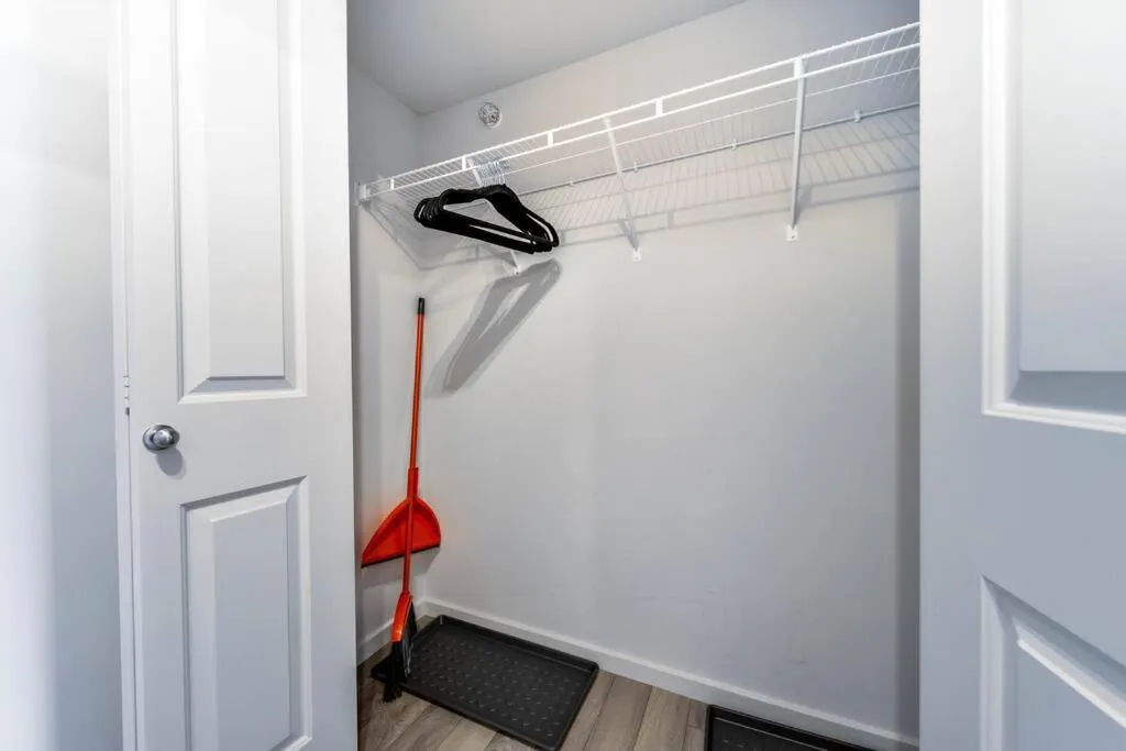 wardrobe in Bright Luxe Condo, AC, Top Floor, King Bed, Balcony!