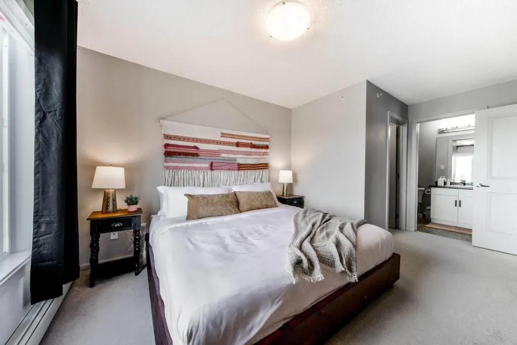 Bed in Bright Luxe Condo, AC, Top Floor, King Bed, Balcony!