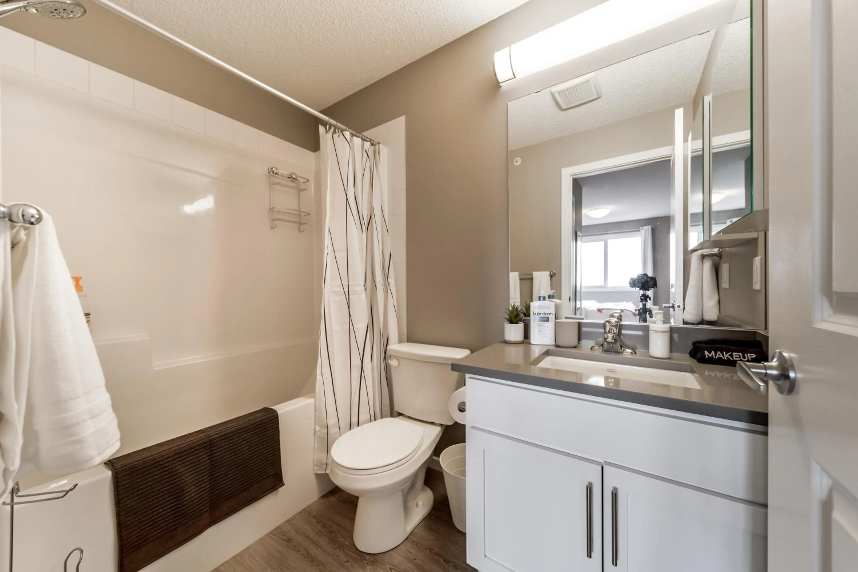 Shower in Peaceful Oasis Condo, AC, Top Floor, Secure UG Parking, Balcony, King Bed!