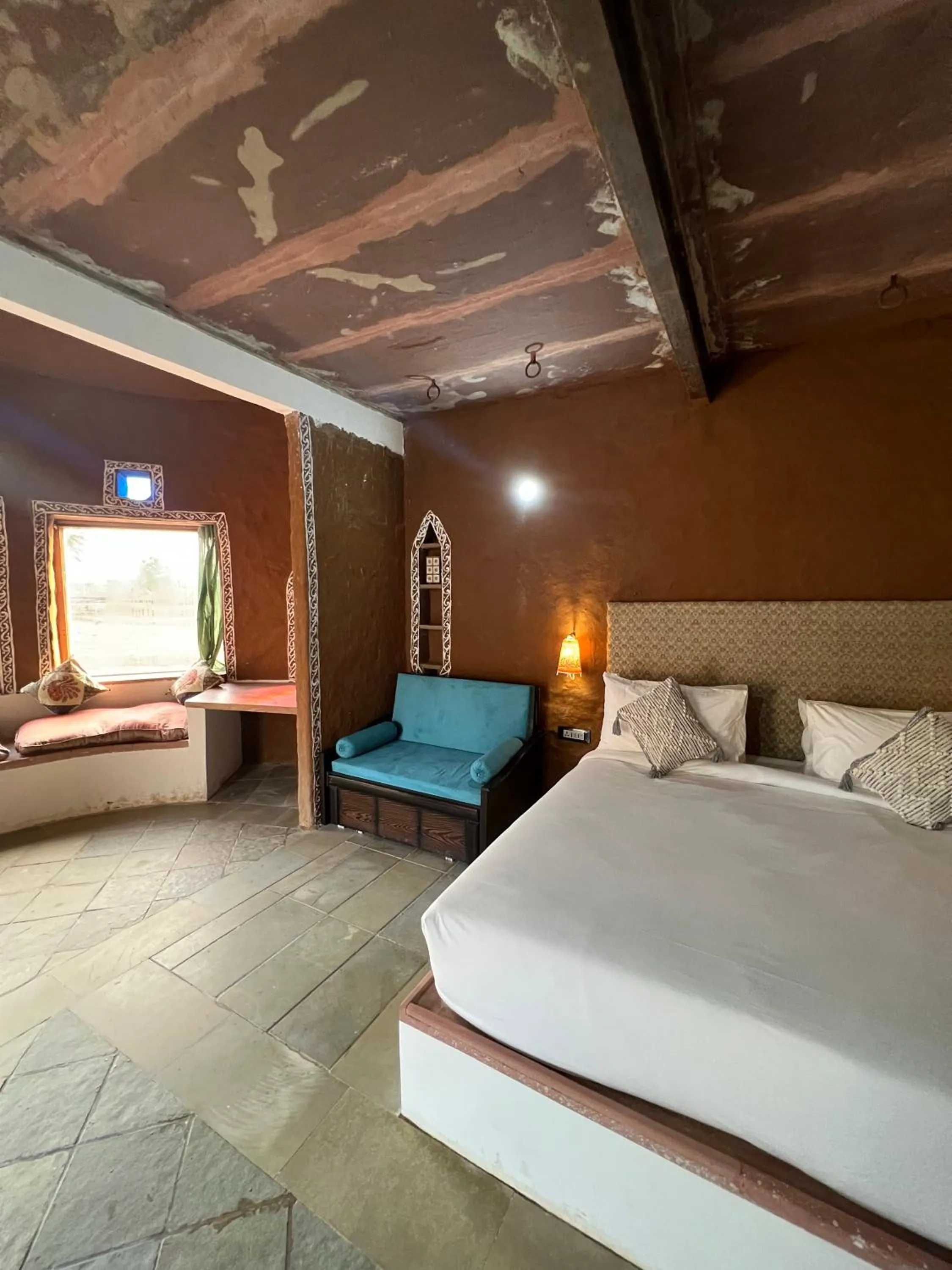 Seating area, Bed in Sariska Kasba - A Village Resort