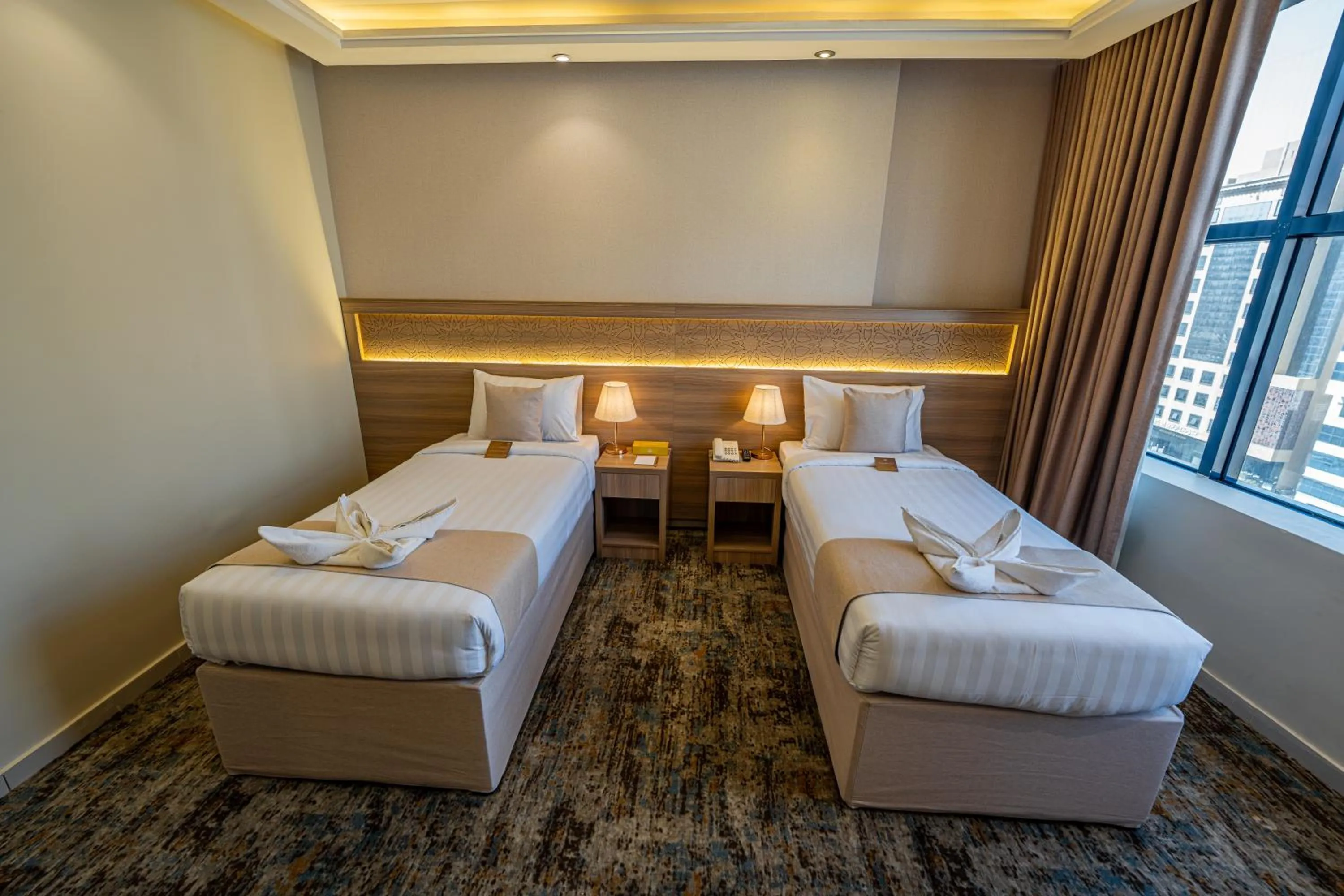 Bed in Snood Al Azama Hotel