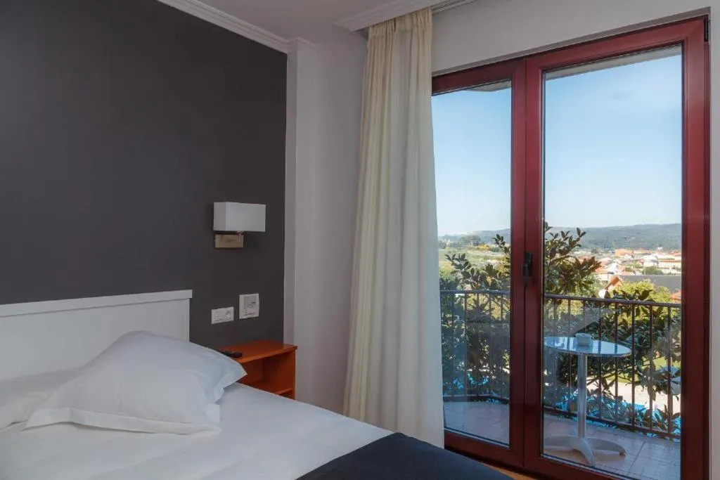 Bed in Hotel Lombiña