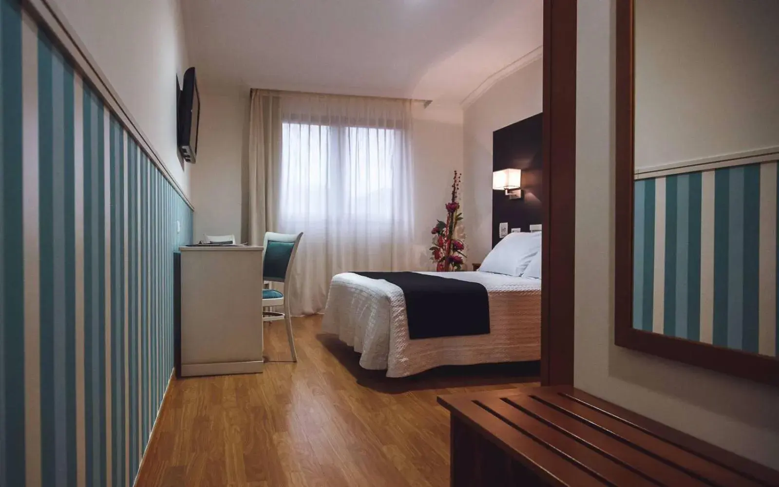 Bed in Hotel Lombiña Bed in Hotel Lombiña