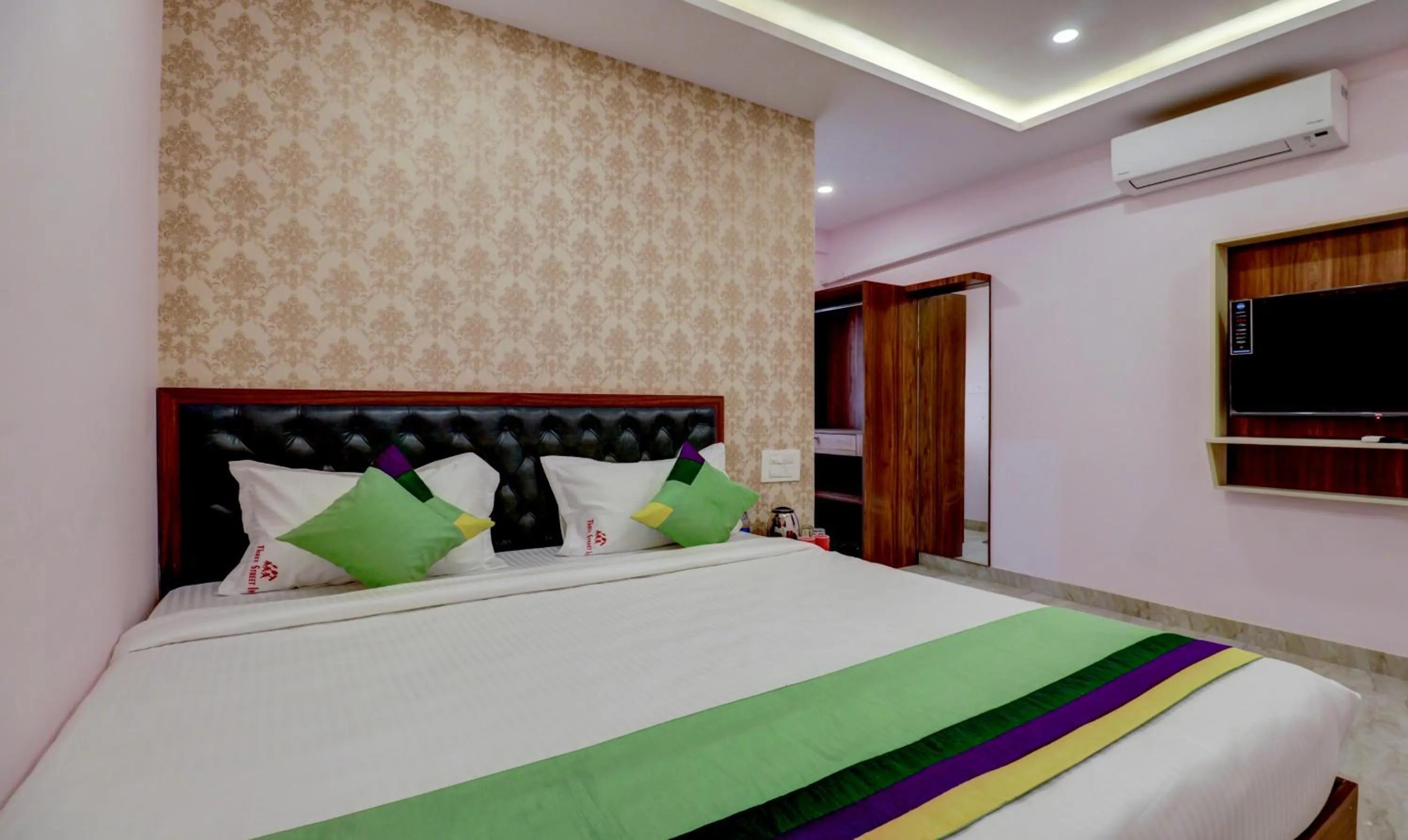 Bedroom, Bed in Treebo Three Street Inn