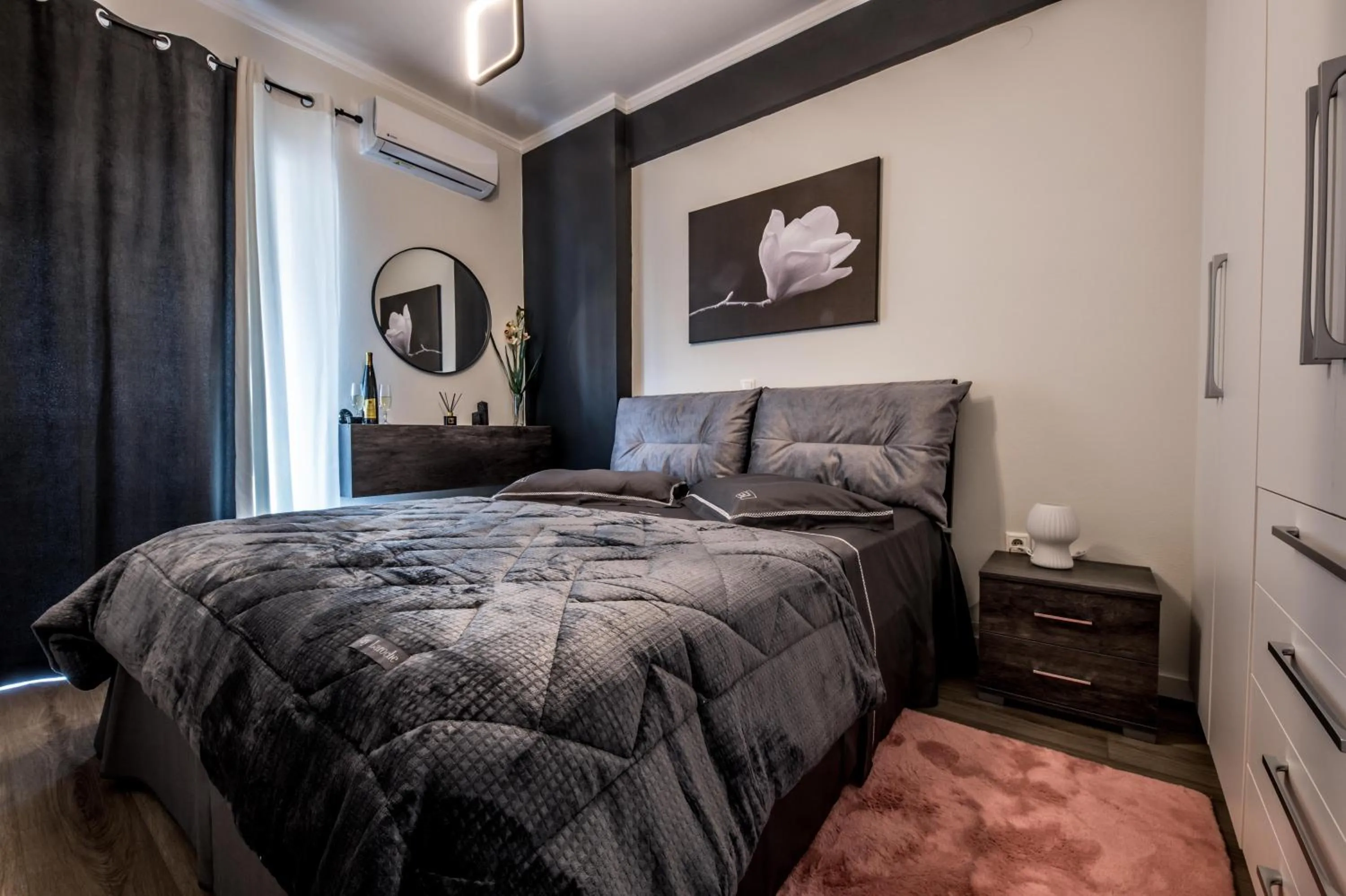 Bed in Escape Luxury Apartment