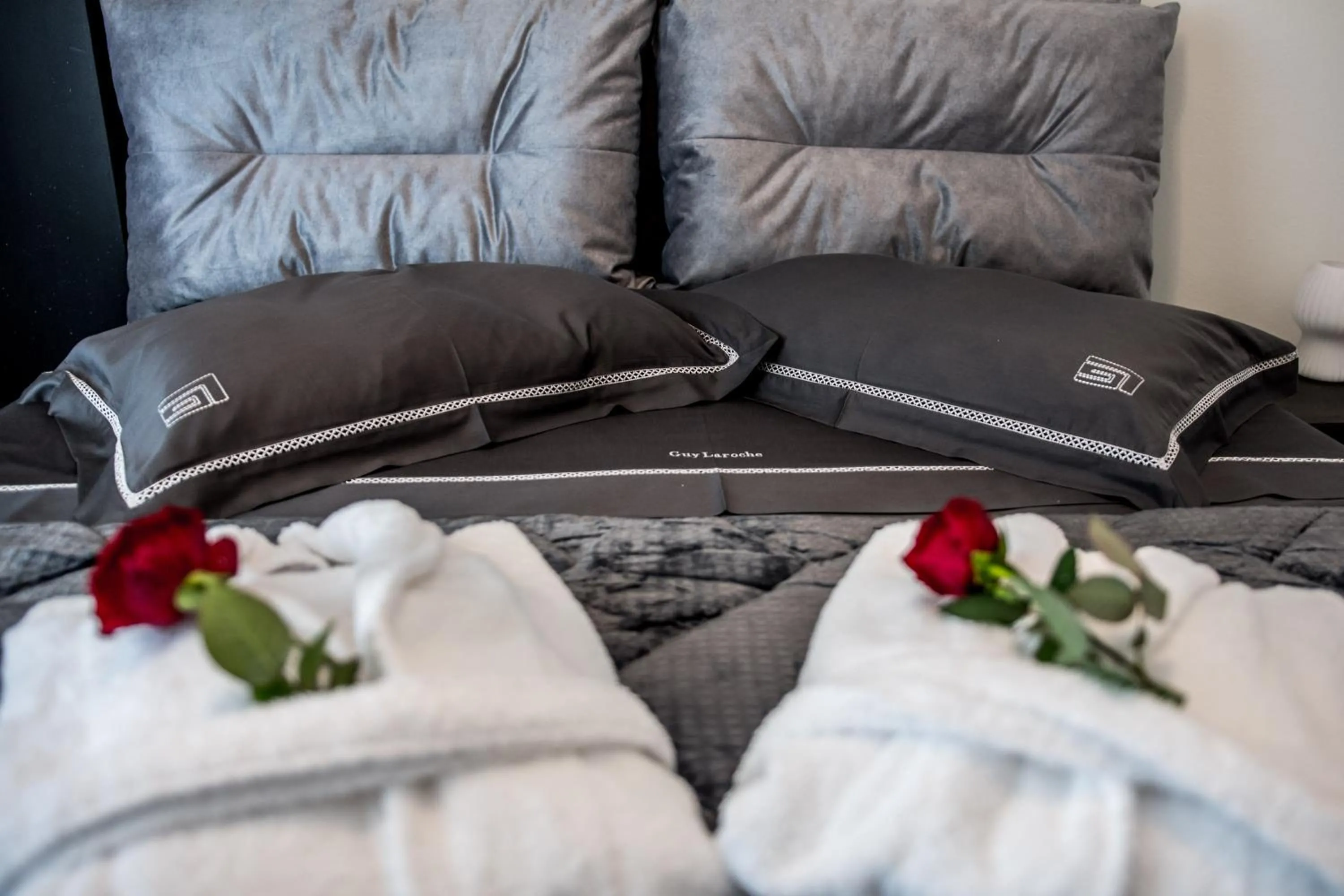 Bed in Escape Luxury Apartment