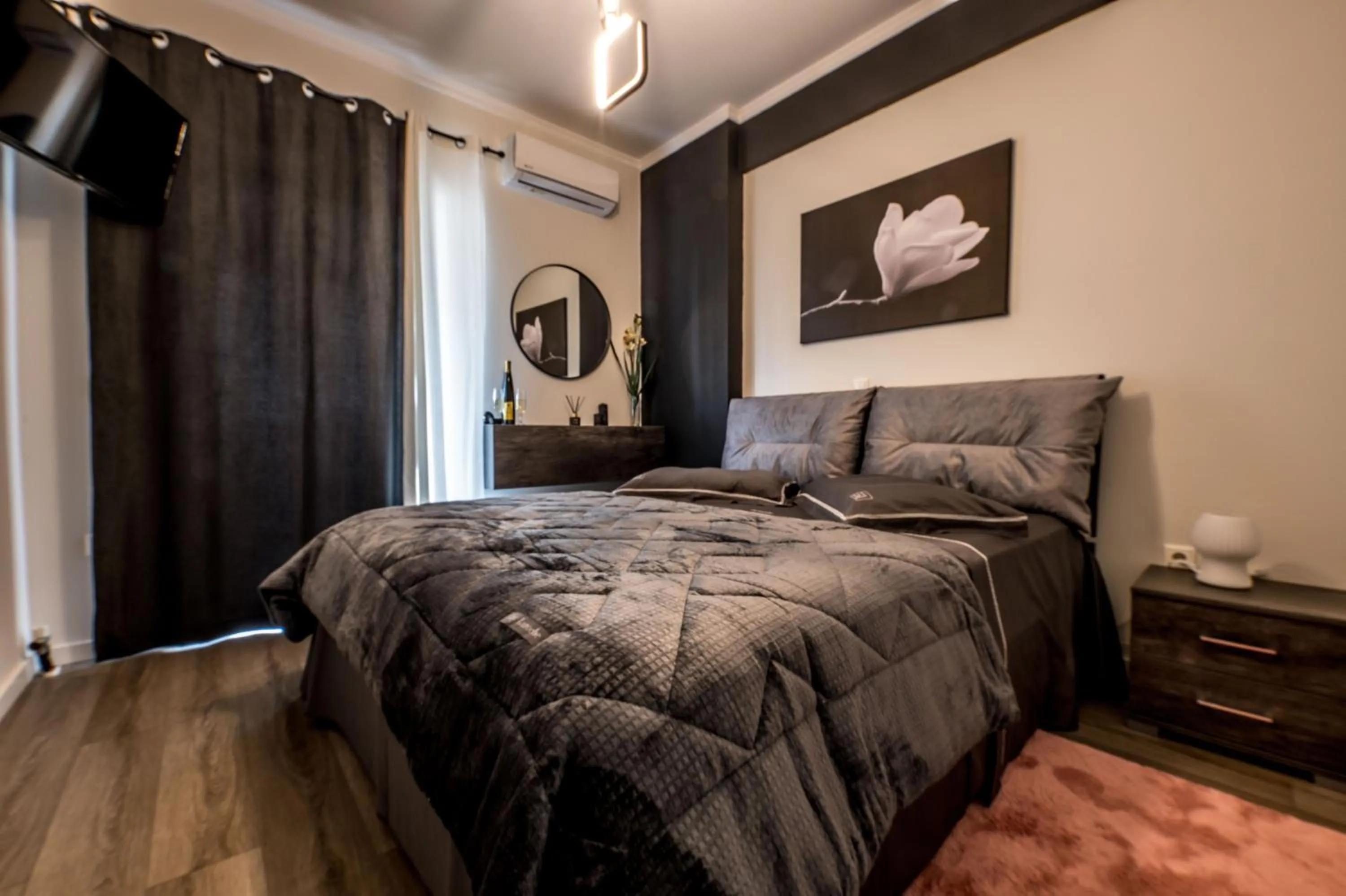 Bed in Escape Luxury Apartment