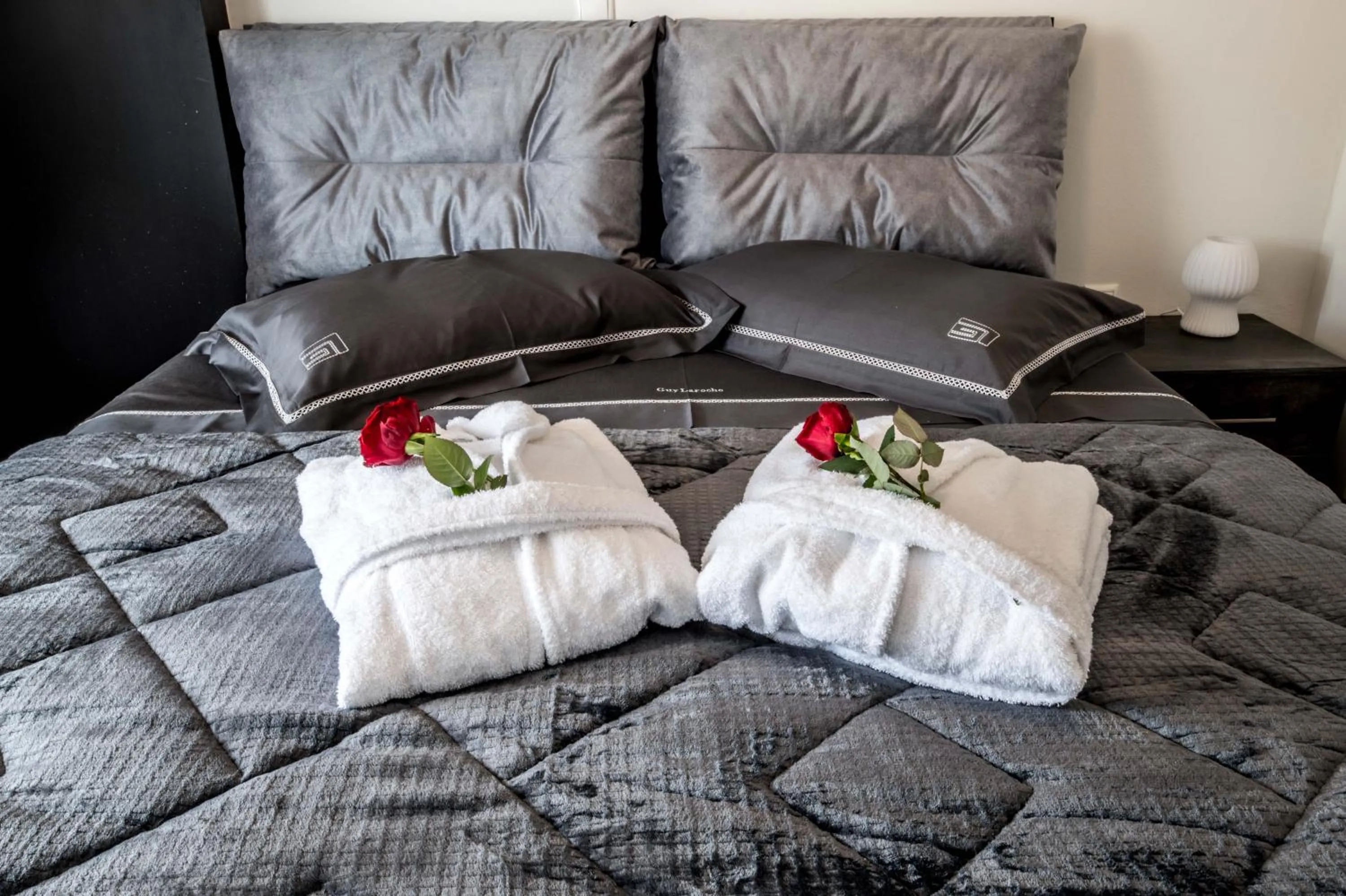 Bed in Escape Luxury Apartment