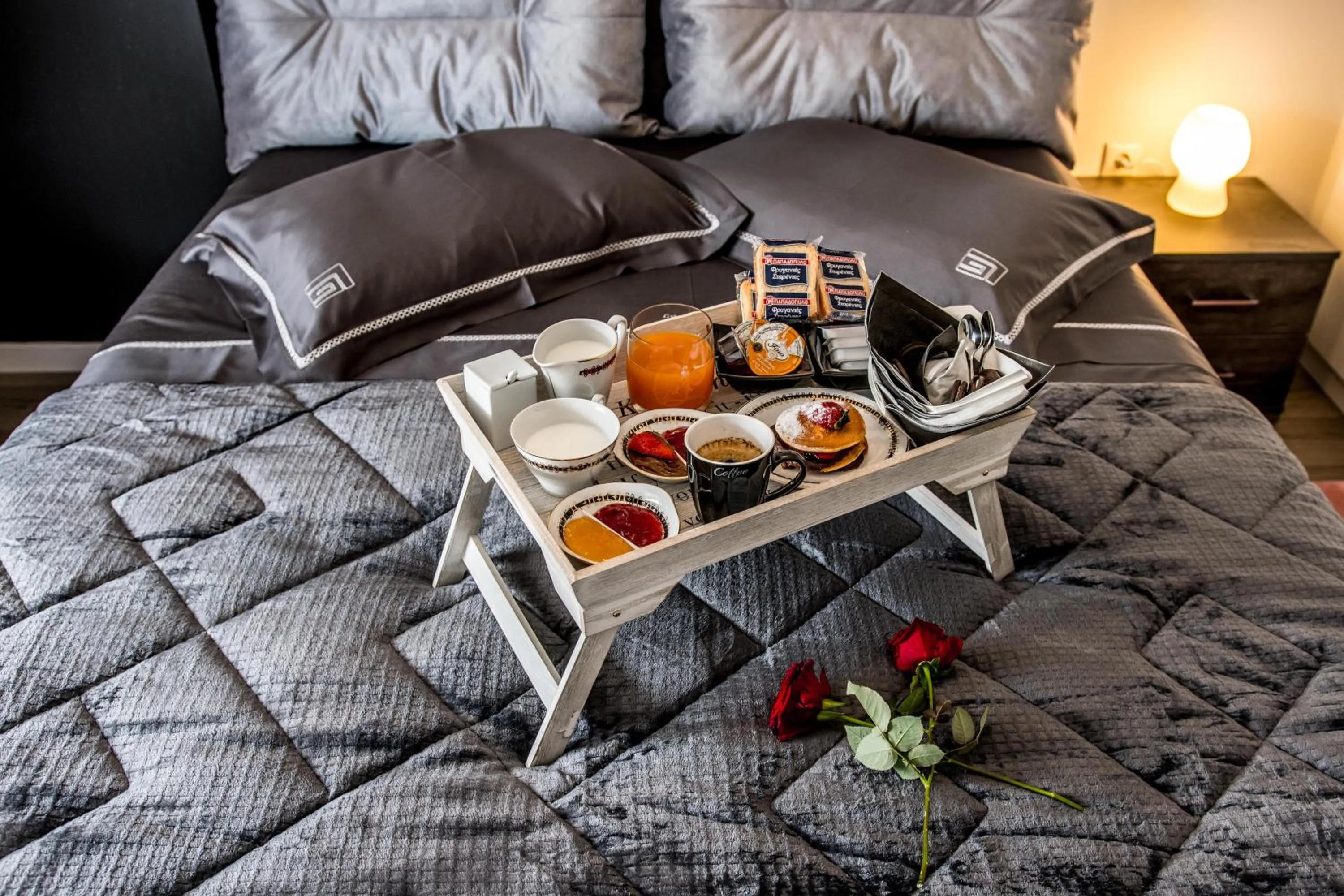 Bed in Escape Luxury Apartment