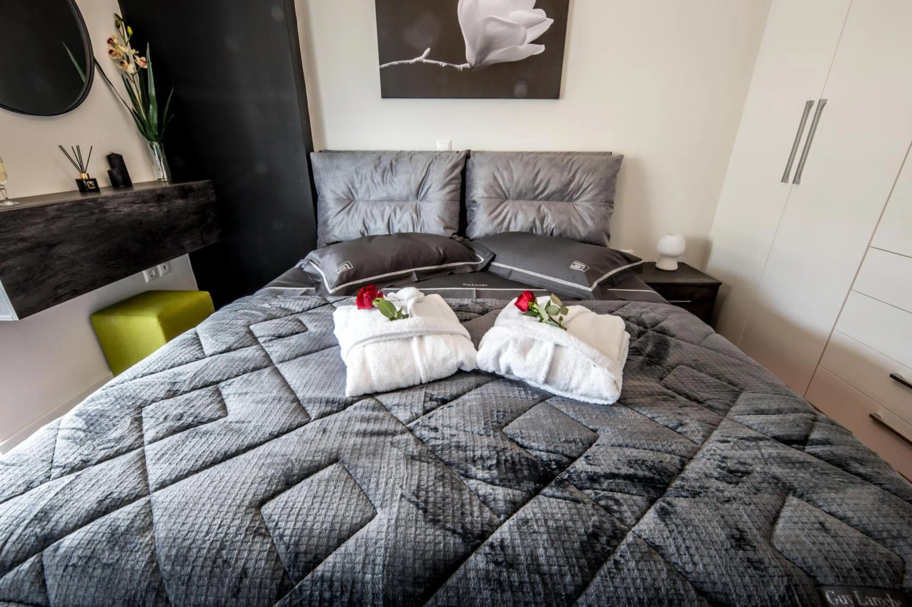 Bed in Escape Luxury Apartment
