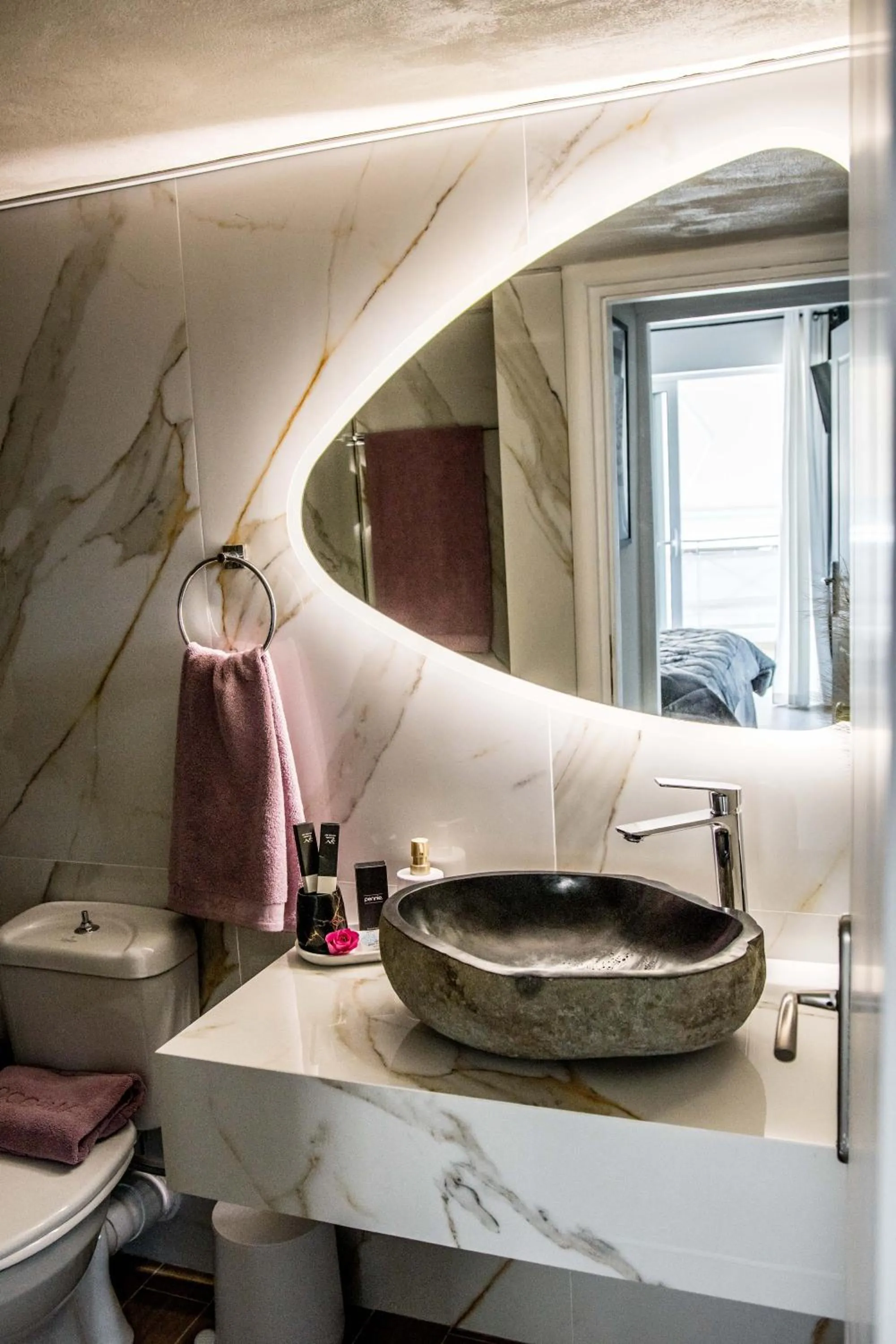 Toilet in Escape Luxury Apartment