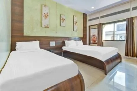 Bed in Hotel Sai Sparsh