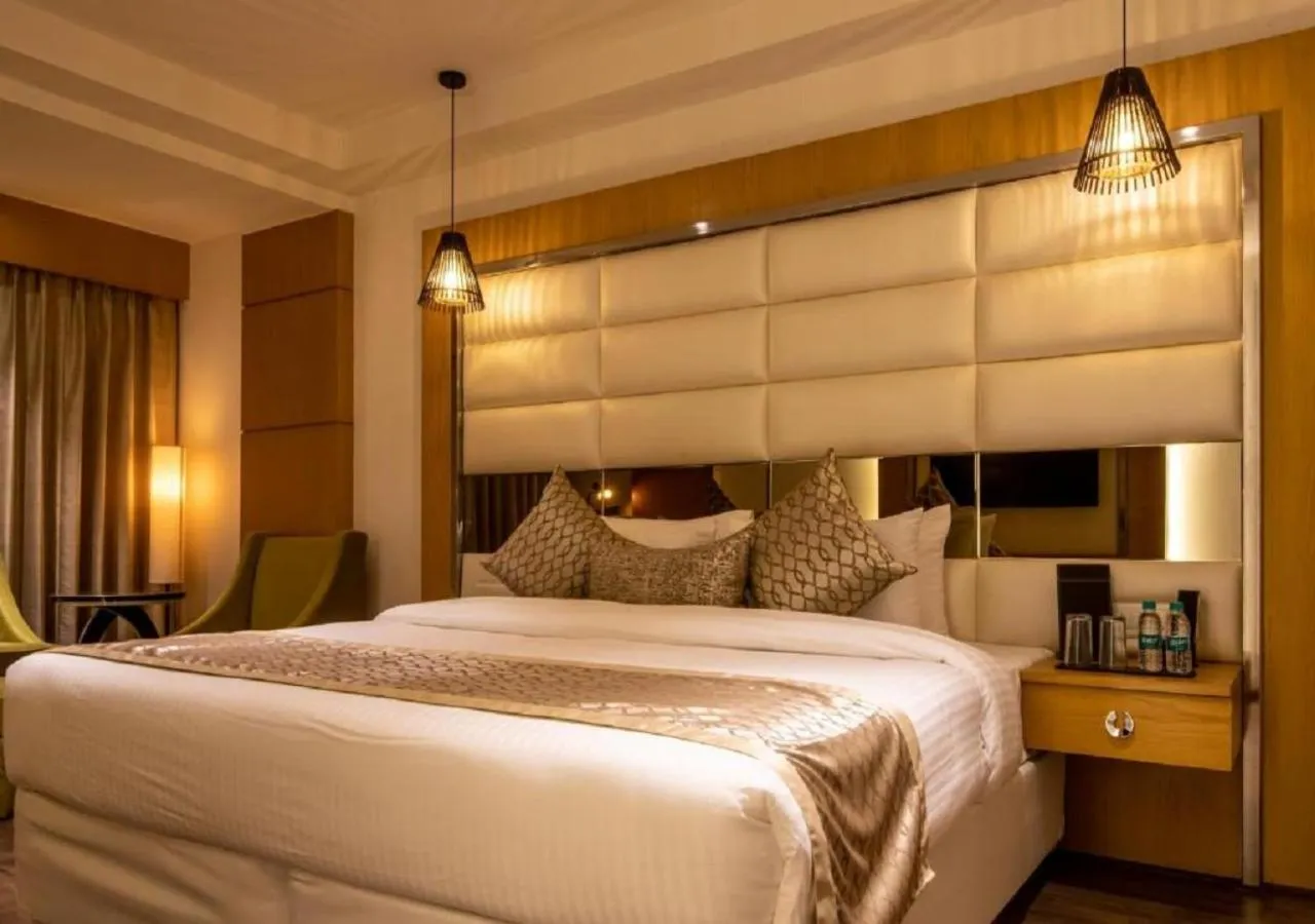 Bed in The Pristine Hotel