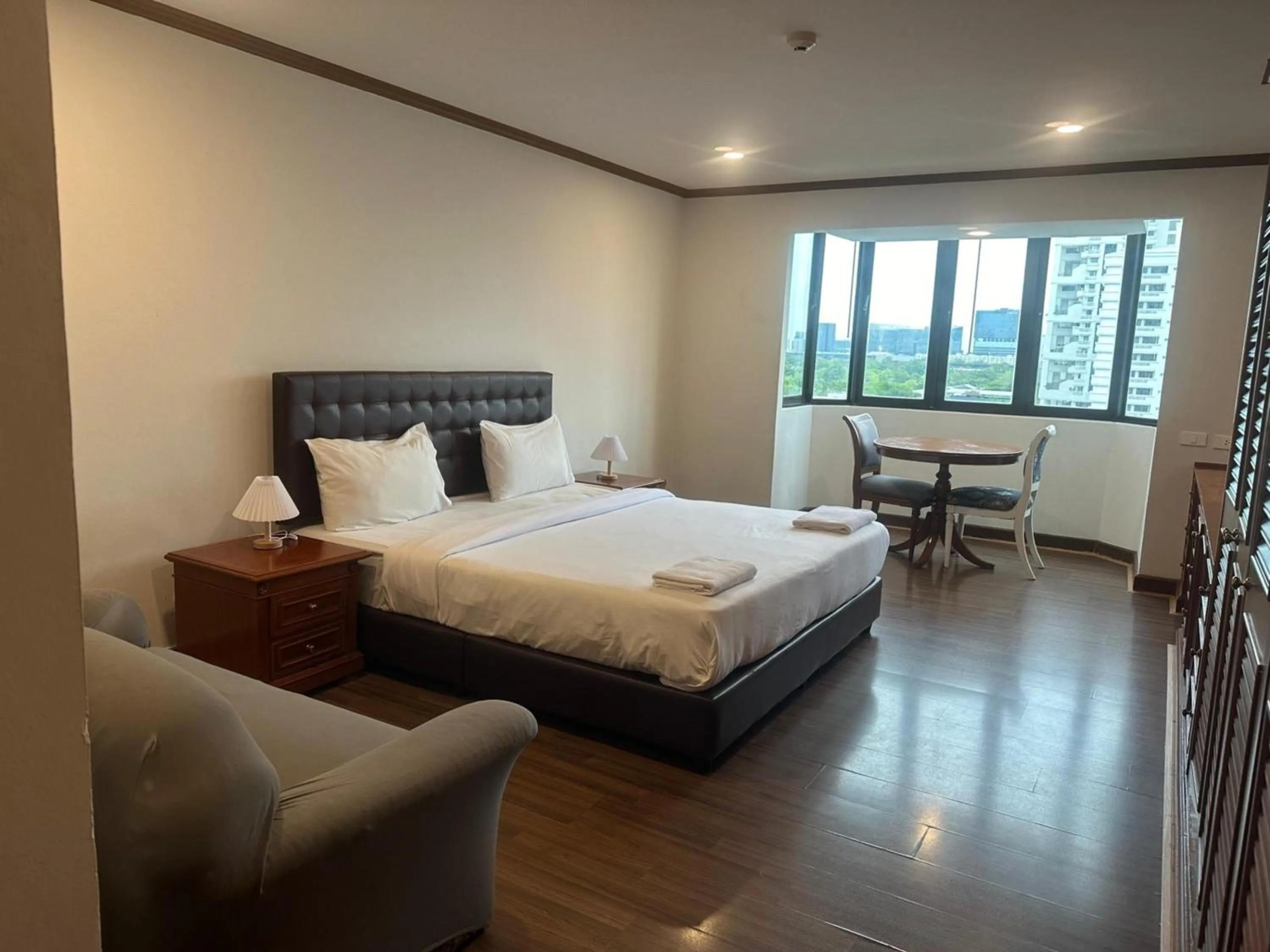 Bedroom, Bed in Omni Tower Direct Rooms - Apartments, Sukhumvit Soi 4