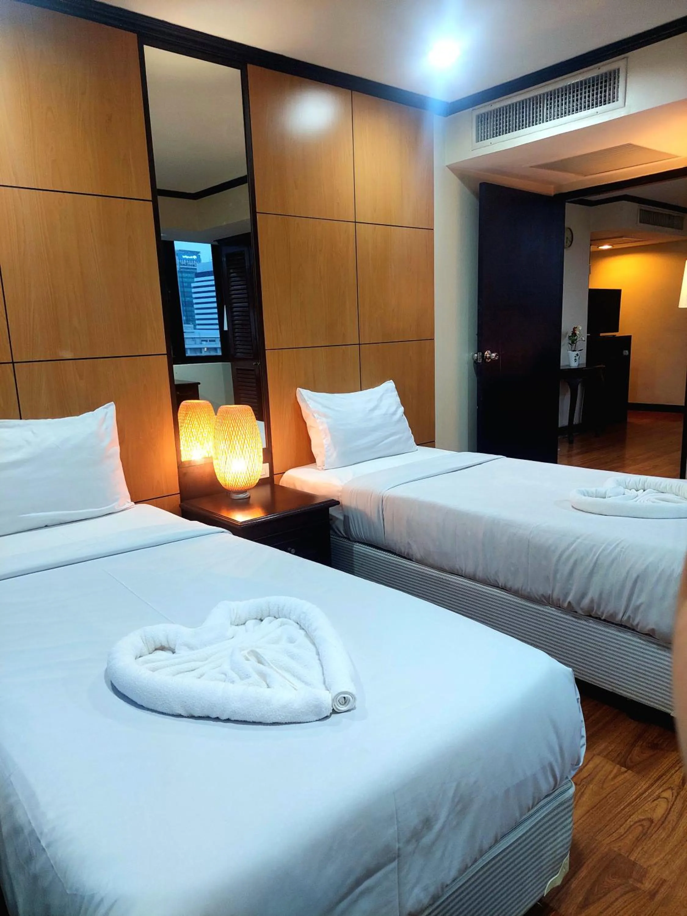 Bedroom, Bed in Omni Tower Direct Rooms - Apartments, Sukhumvit Soi 4