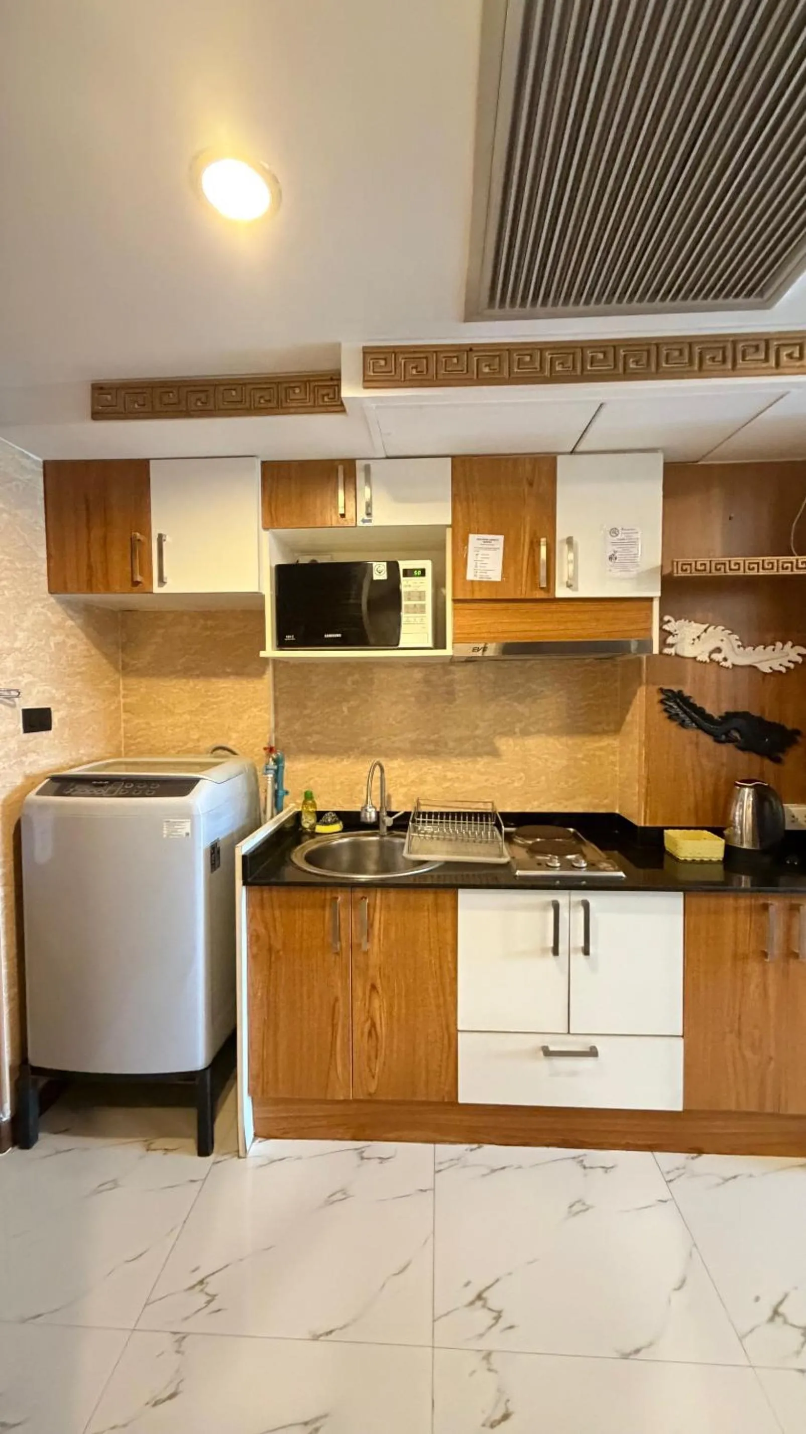 Kitchen or kitchenette in Omni Tower Direct Rooms - Apartments, Sukhumvit Soi 4