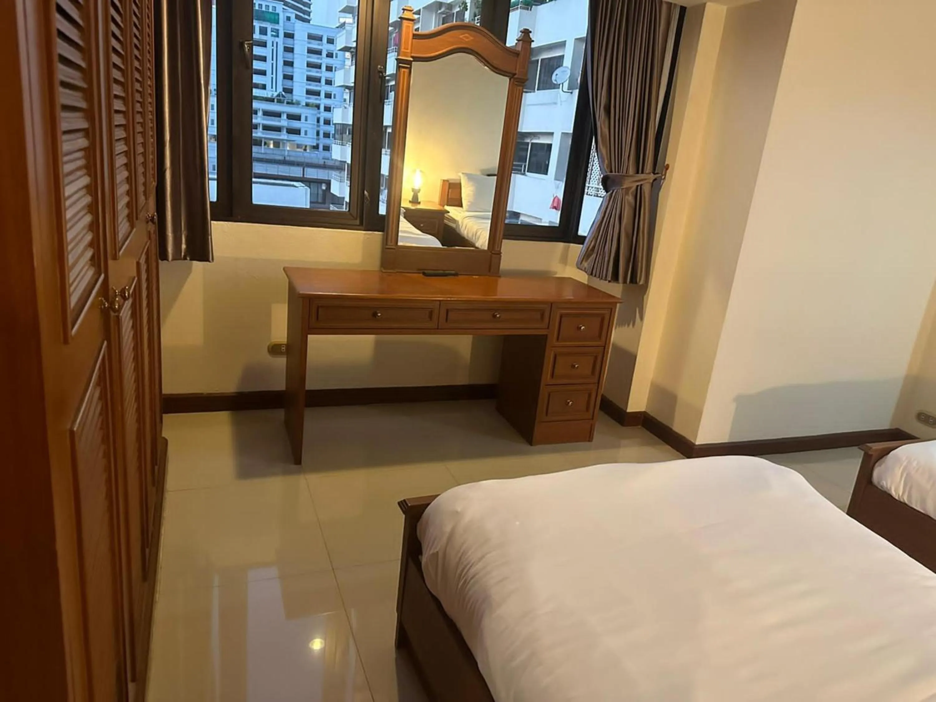 Bedroom, Bed in Omni Tower Direct Rooms - Apartments, Sukhumvit Soi 4