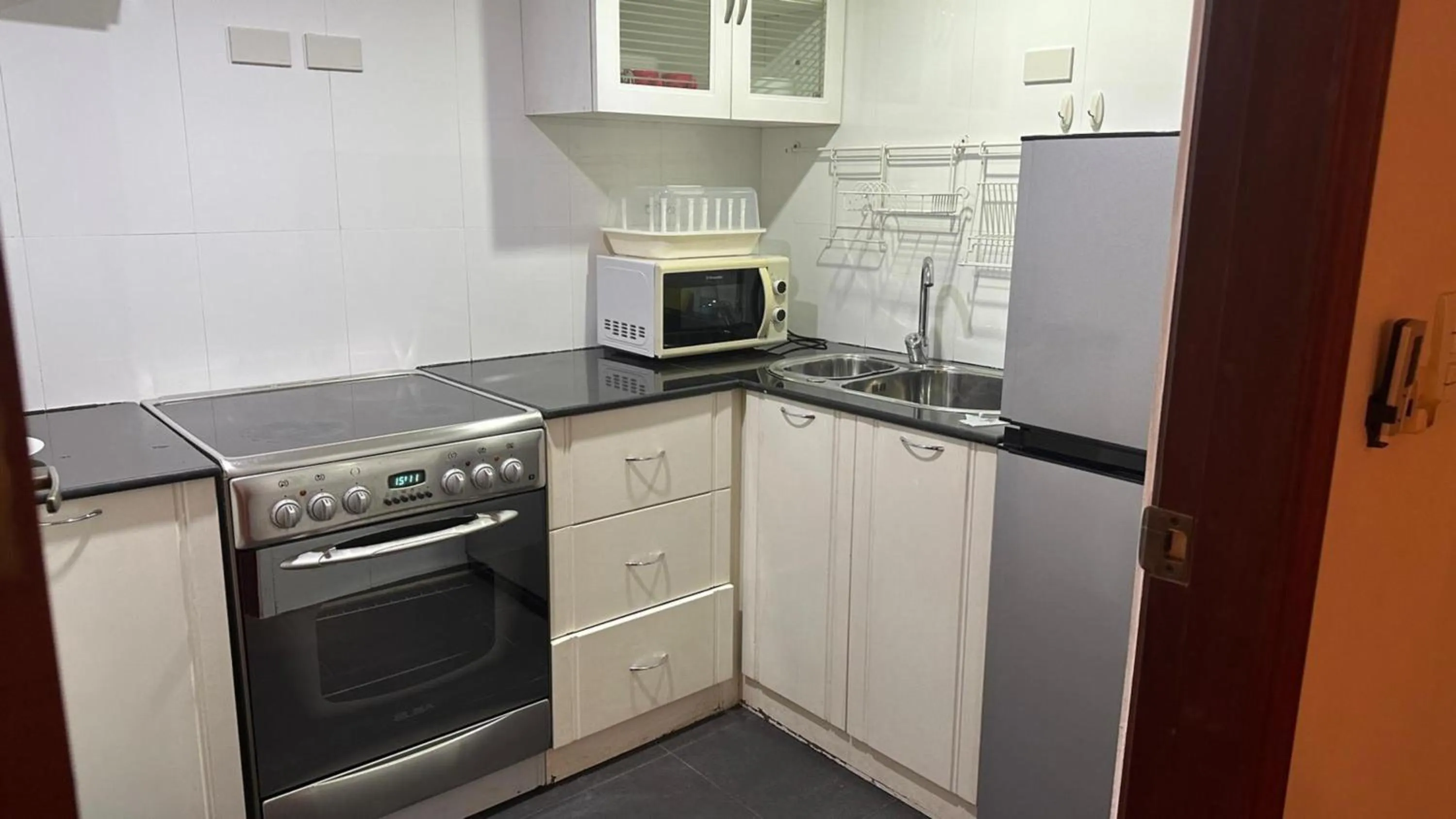 Kitchen or kitchenette in Omni Tower Direct Rooms - Apartments, Sukhumvit Soi 4