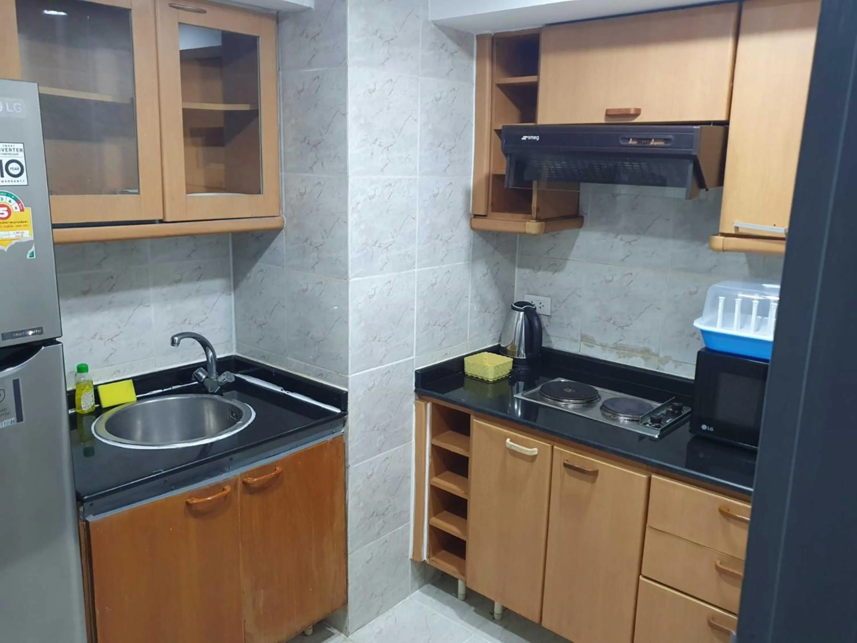 Kitchen or kitchenette in Omni Tower Direct Rooms - Apartments, Sukhumvit Soi 4