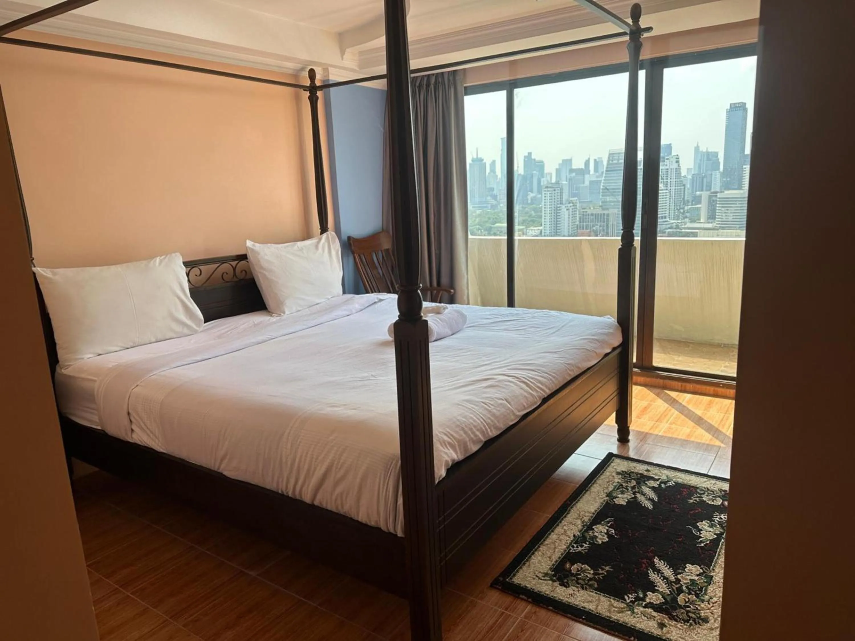 Bedroom, Bed in Omni Tower Direct Rooms - Apartments, Sukhumvit Soi 4