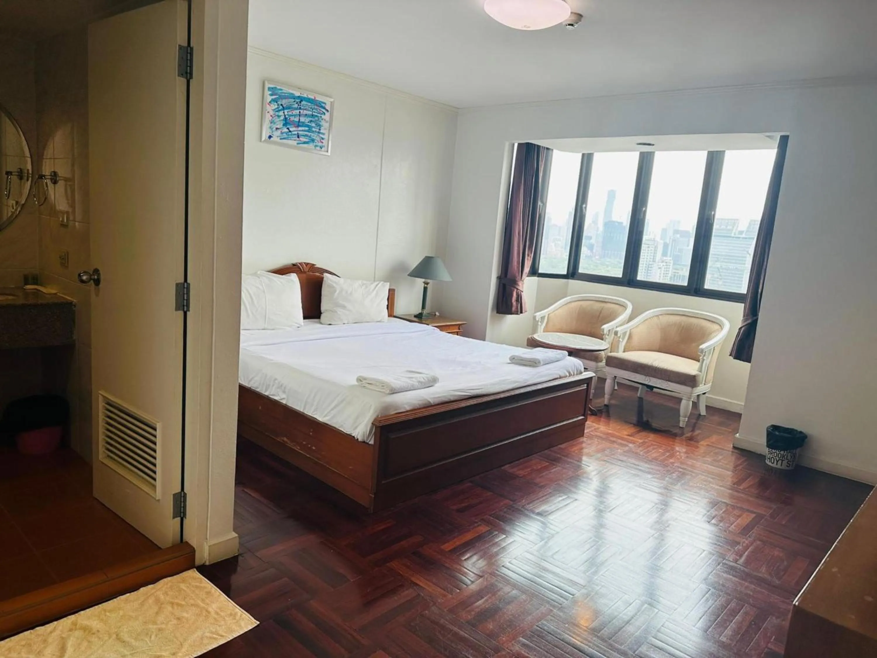 Bedroom, Bed in Omni Tower Direct Rooms - Apartments, Sukhumvit Soi 4