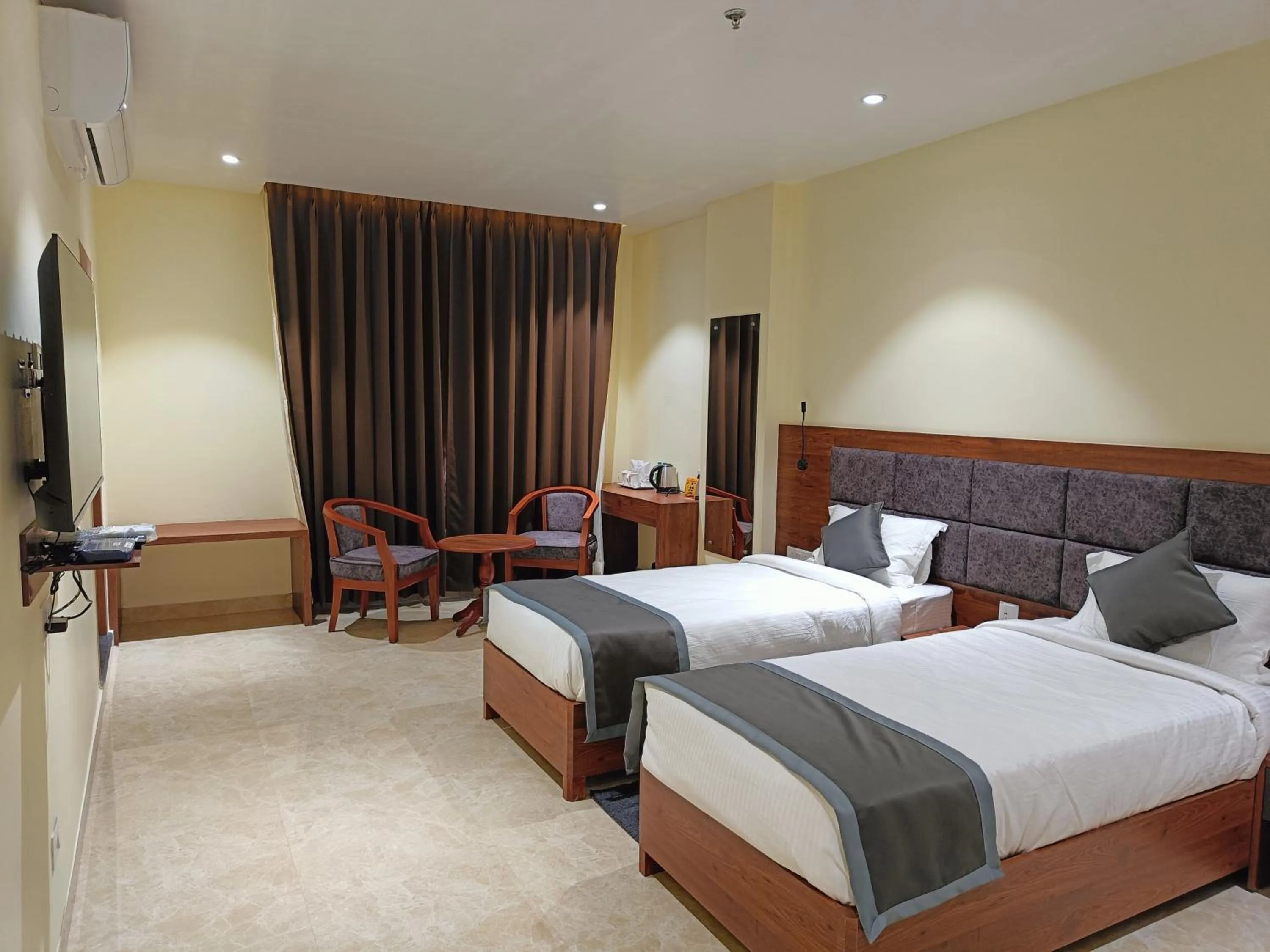 Bed in HOTEL GOLDEN ORCHID