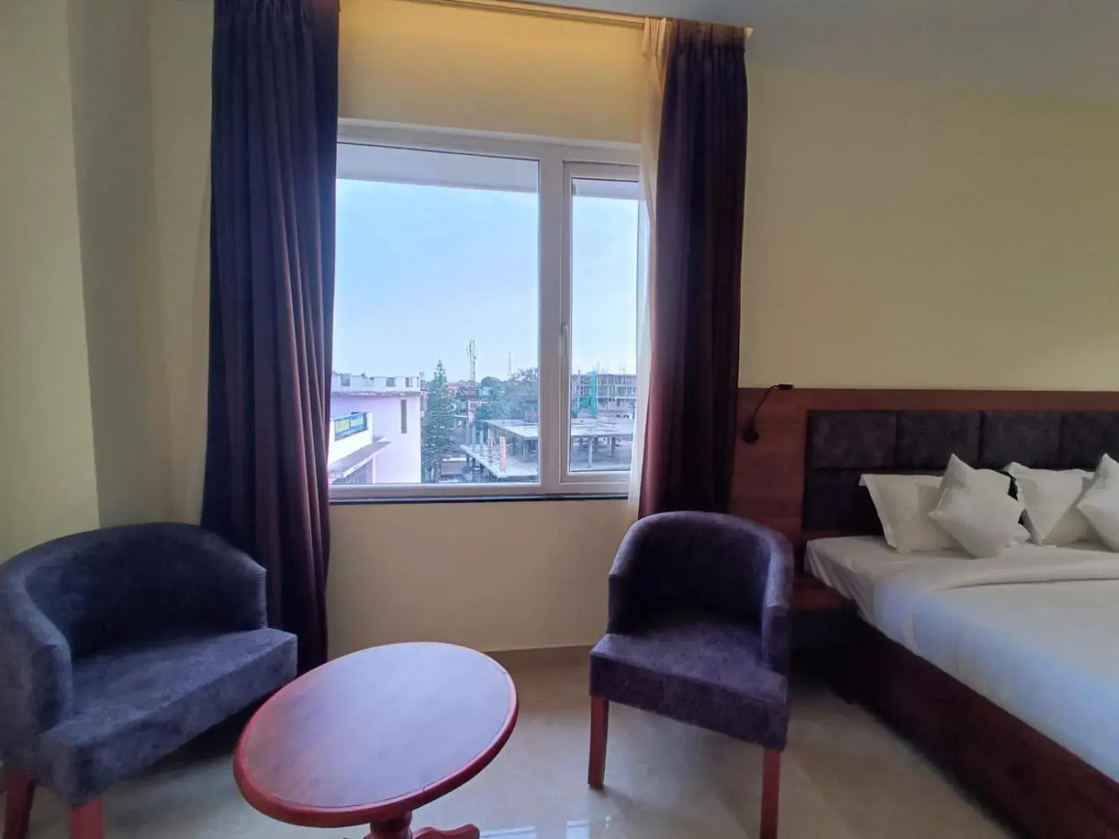 Seating area, Bed in HOTEL GOLDEN ORCHID Seating area, Bed in HOTEL GOLDEN ORCHID