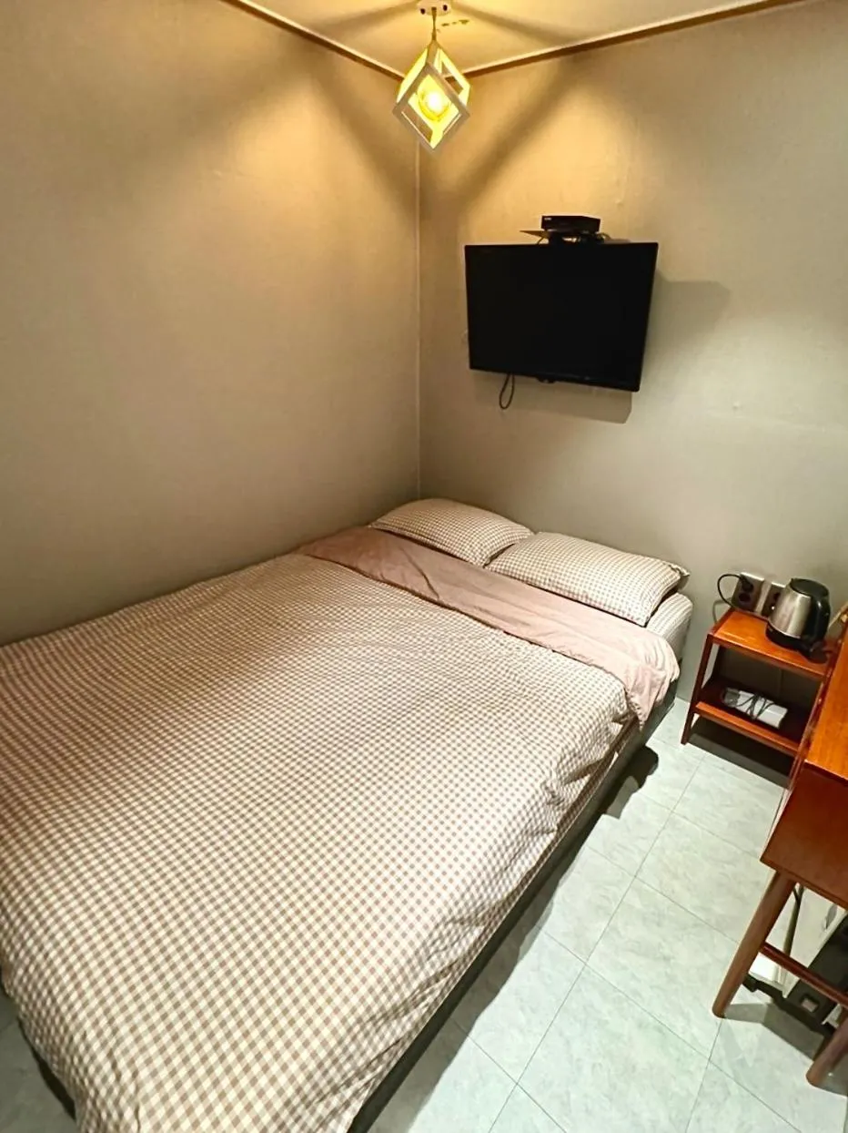 Bed in Maison Yongsan Myeongdon Hotel