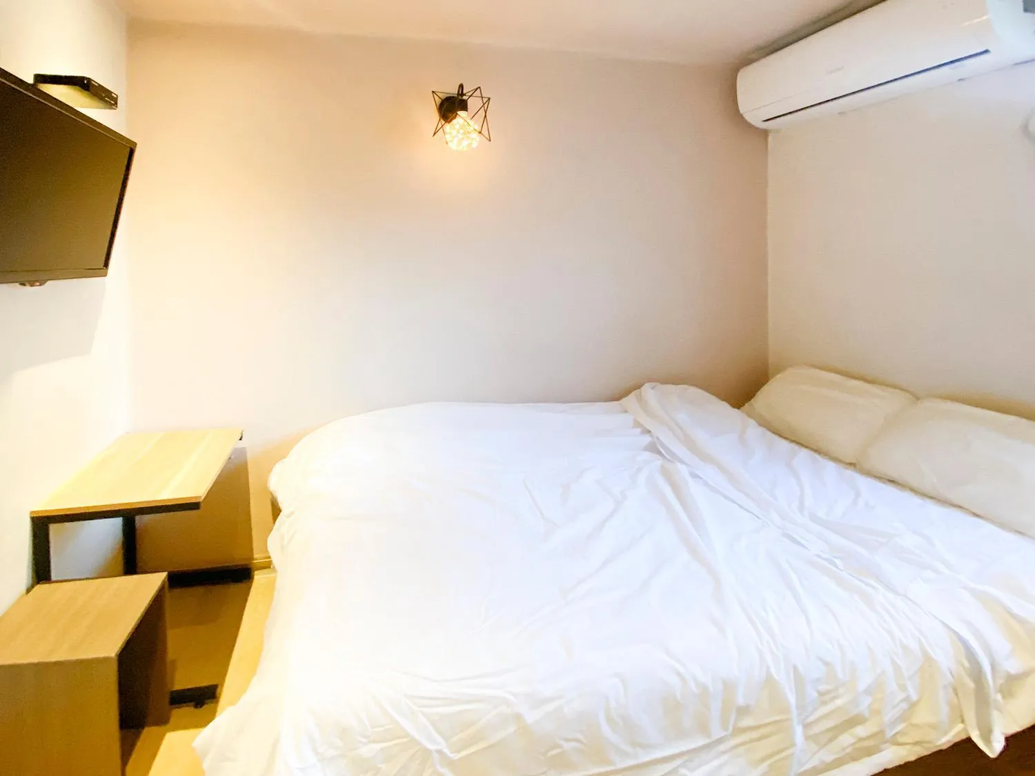Bed in Maison Yongsan Myeongdon Hotel
