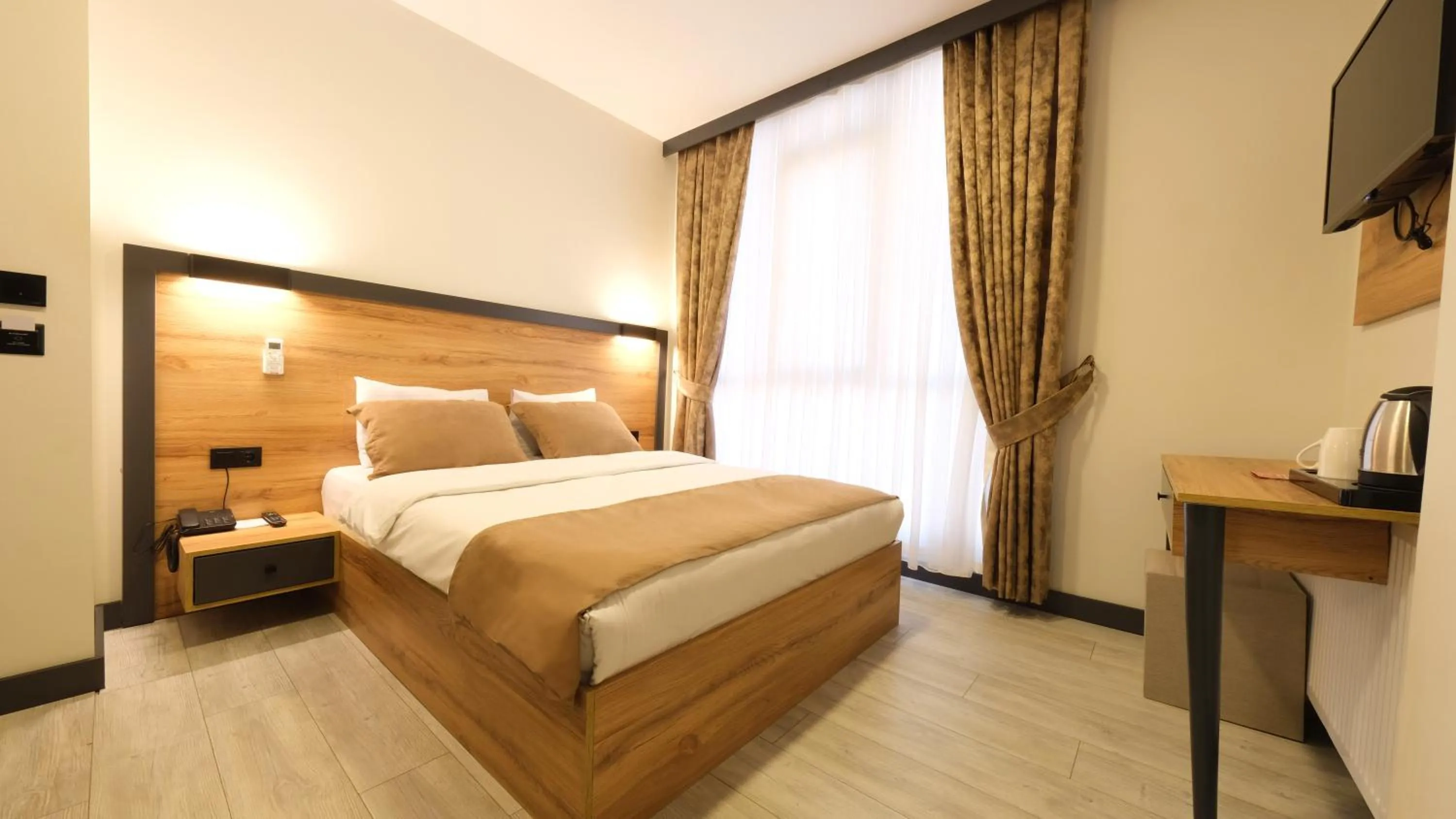 Bed in Sirius Hotel Deluxe