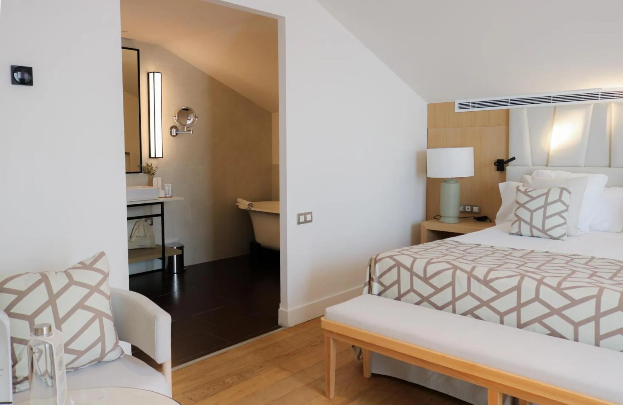 Bathroom, Bed in Hospes Palau de La Mar, Valencia, a Member of Design Hotels