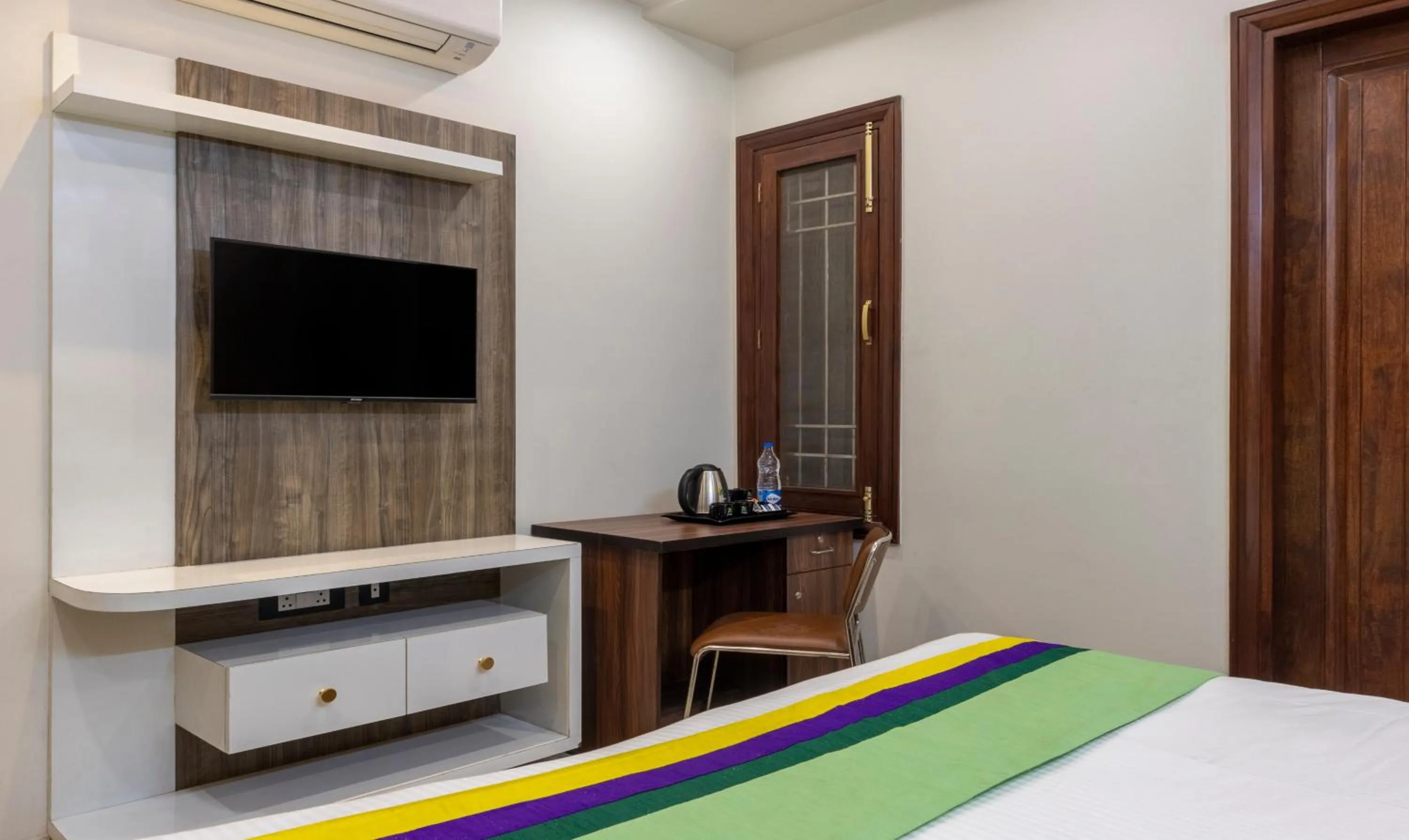 Bed in Treebo MVM Residency