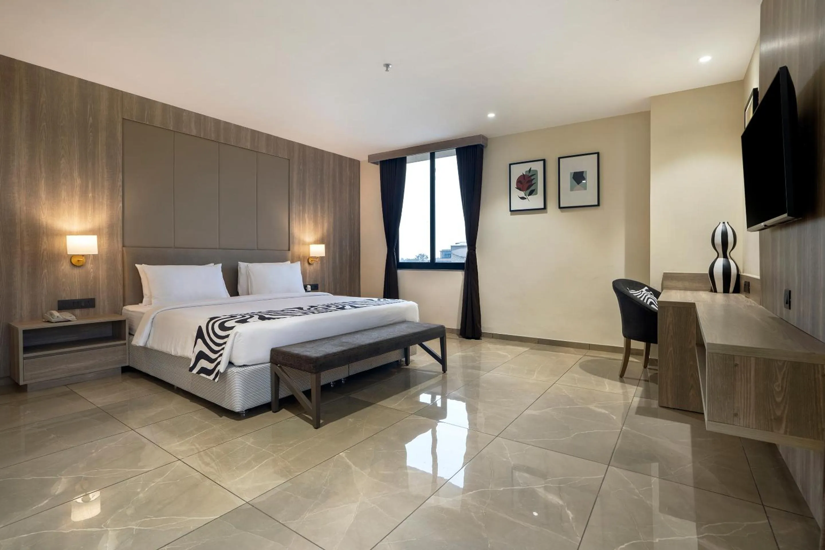 Bed in Sunday Hotel Vadodara