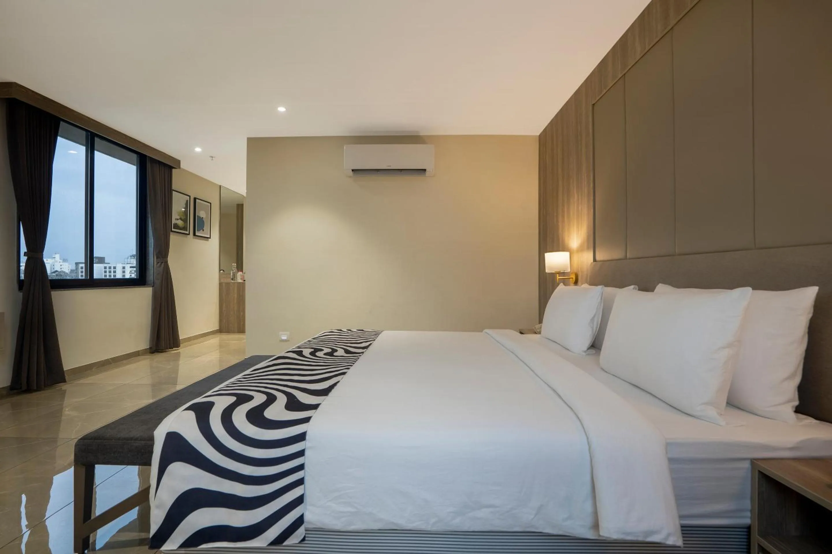 Bed in Sunday Hotel Vadodara