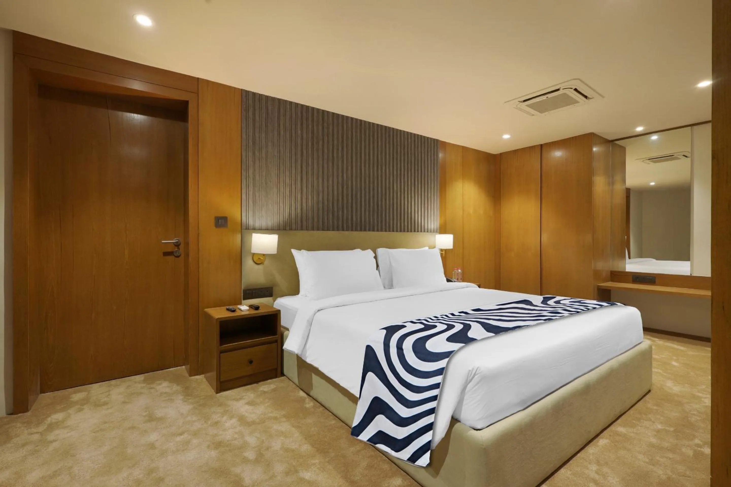 Bed in Sunday Hotel Vadodara