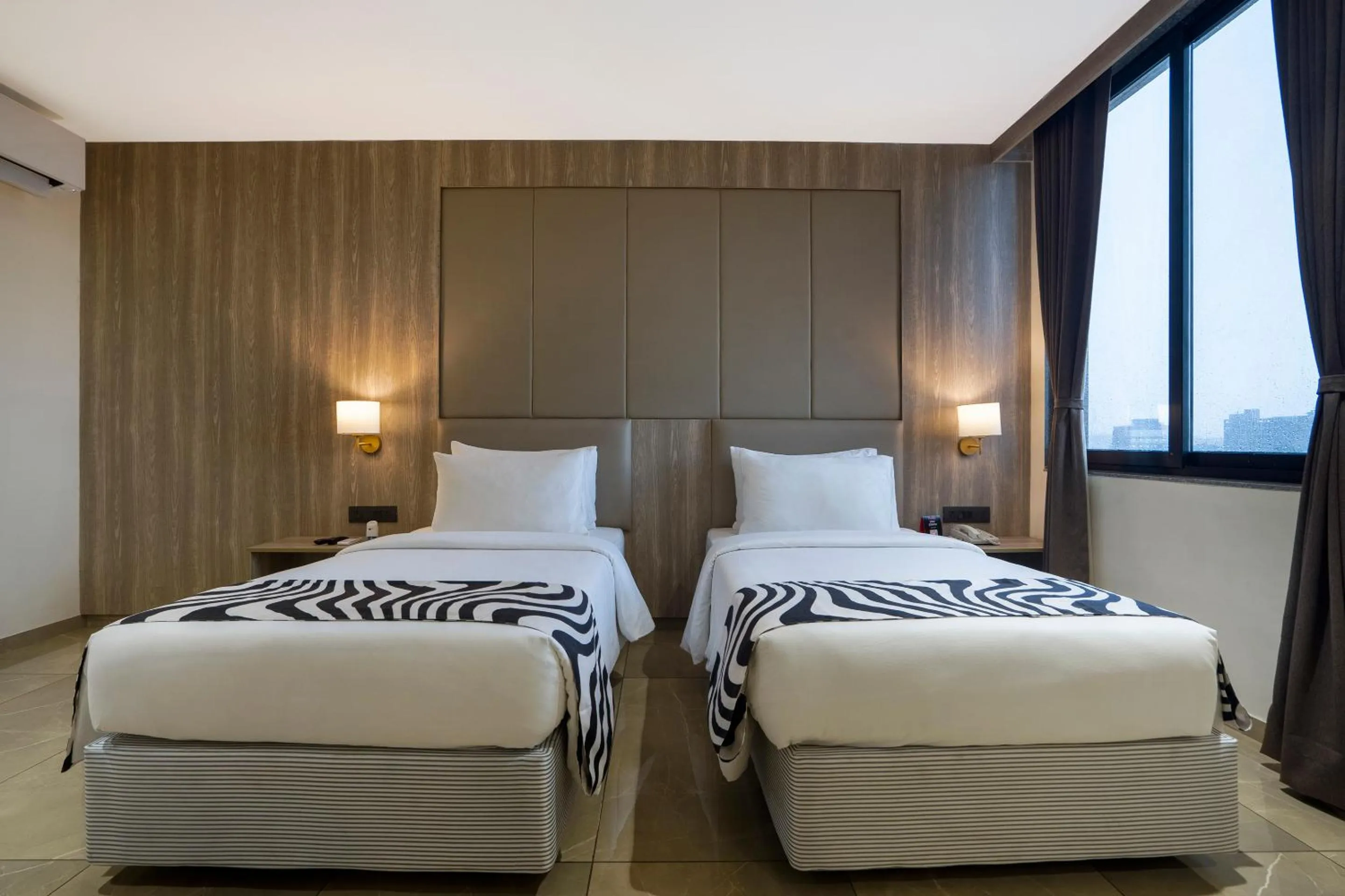 Bed in Sunday Hotel Vadodara