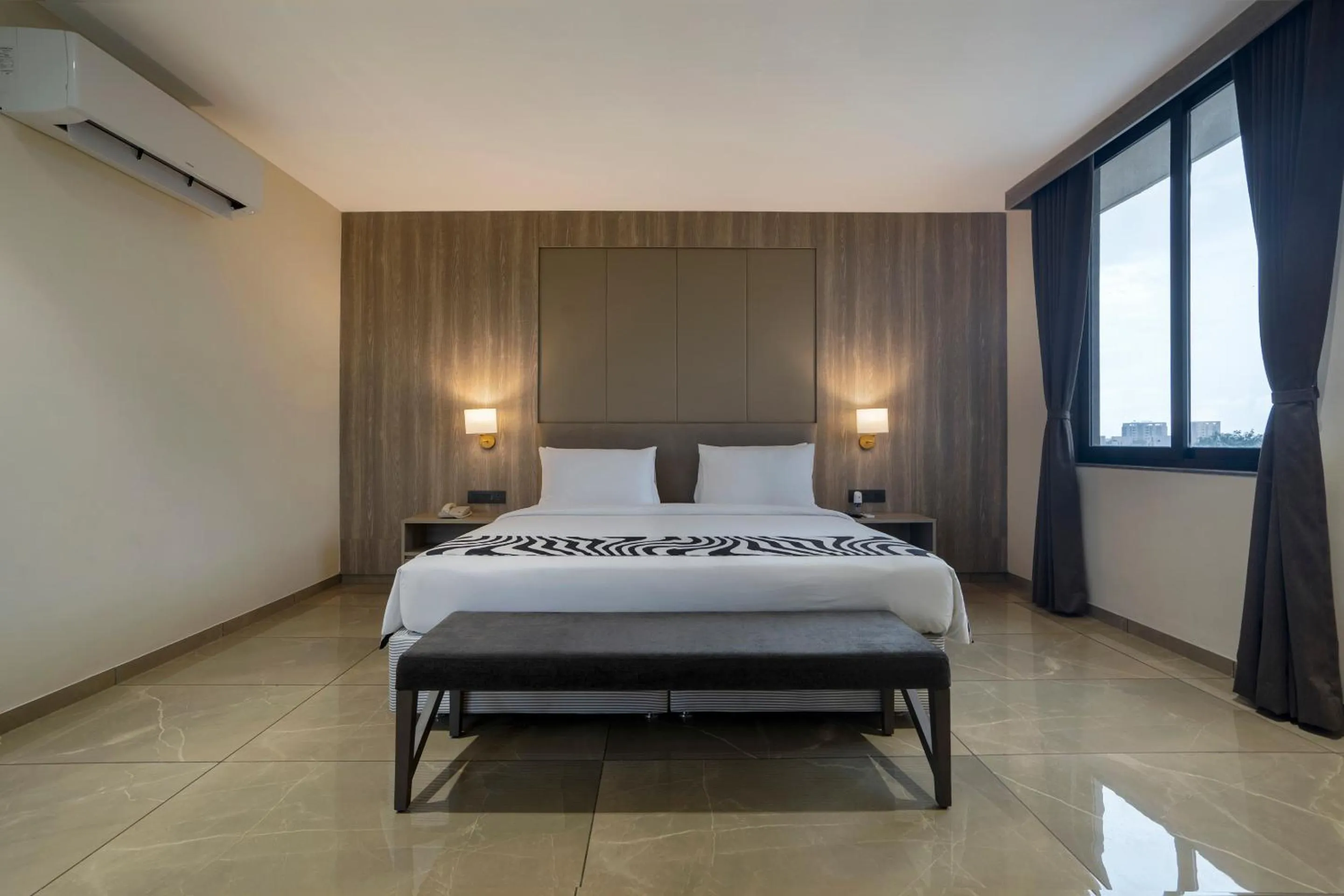 Photo of the whole room, Bed in Sunday Hotel Vadodara