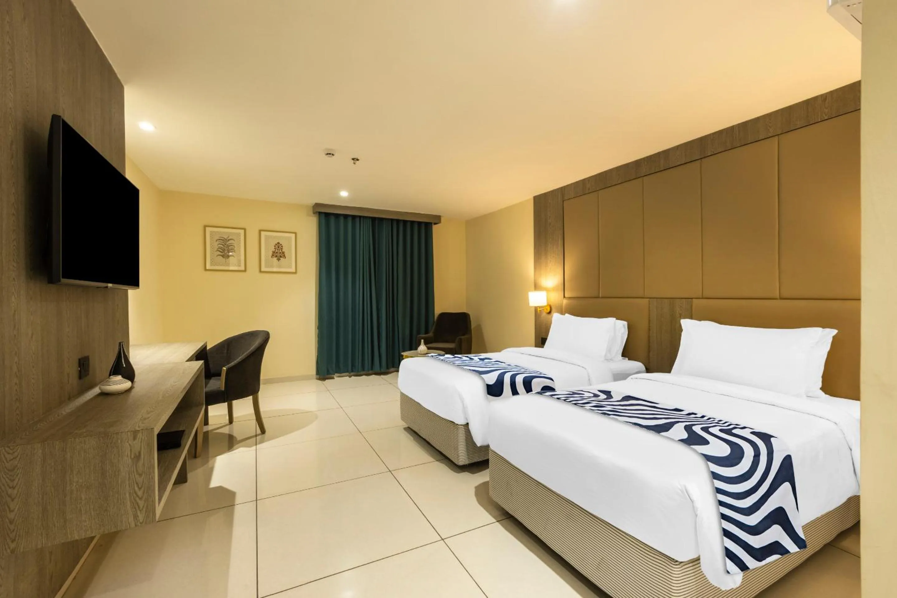 Bed in Sunday Hotel Vadodara