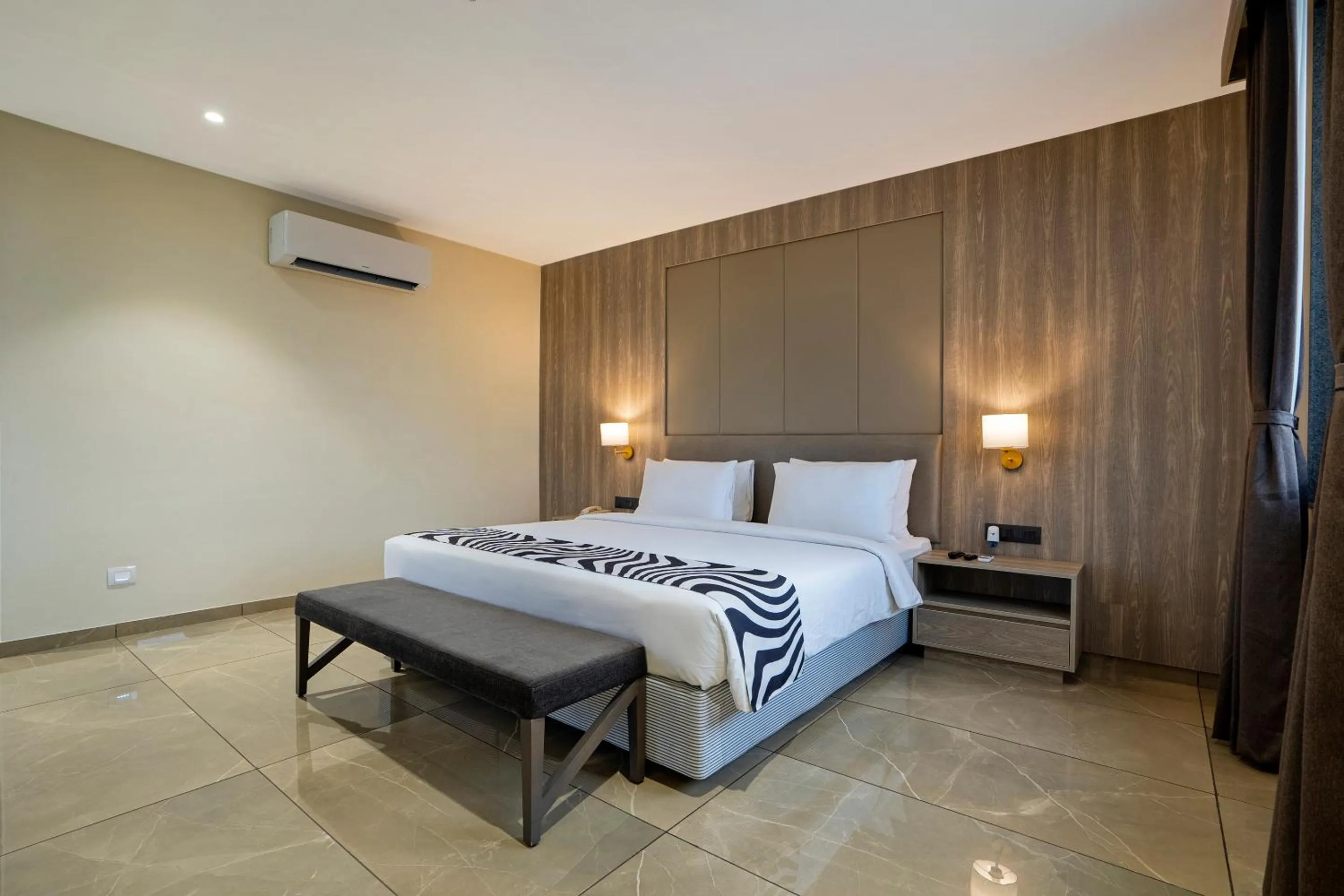 Bed in Sunday Hotel Vadodara