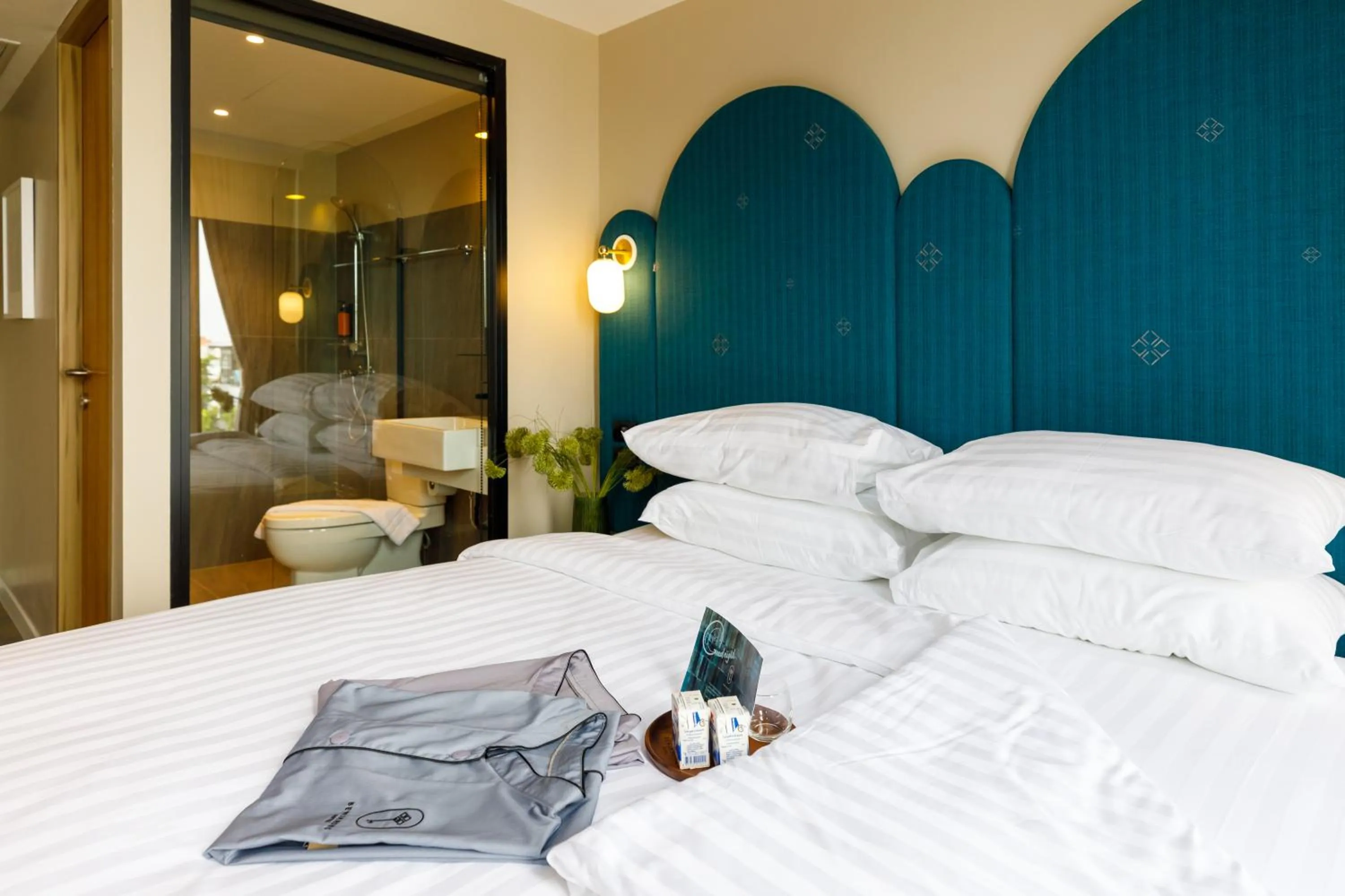 Bed in Benjarong Hotel Bangkok Ratchada