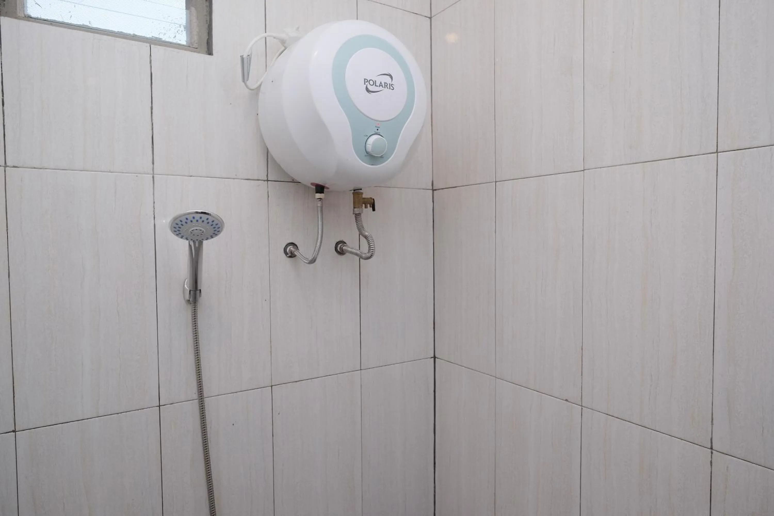 Bathroom in Urbanview Syariah Zidney 3 Salatiga by RedDoorz