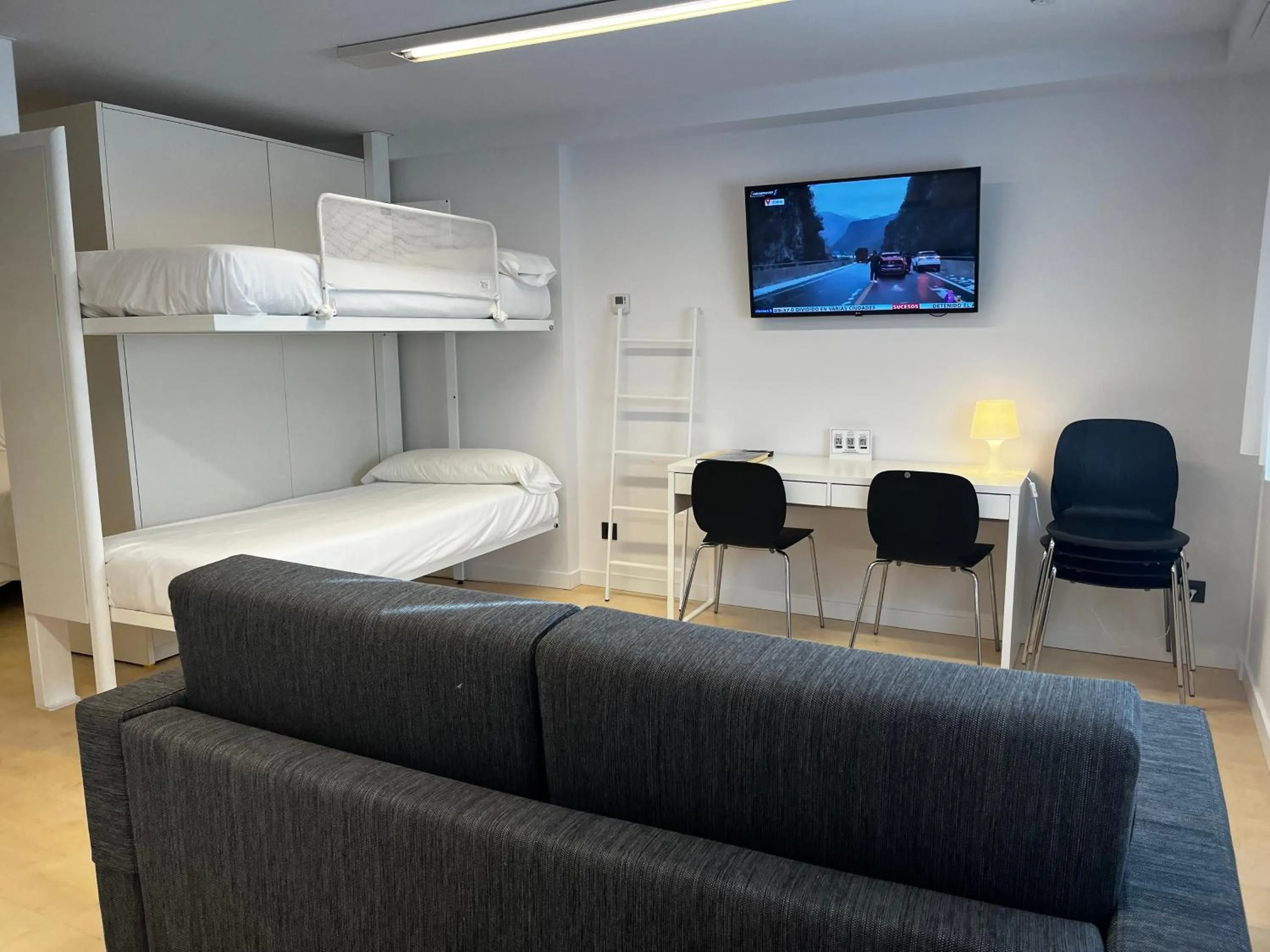 Living room, Bed in Apartamentos Mundaka