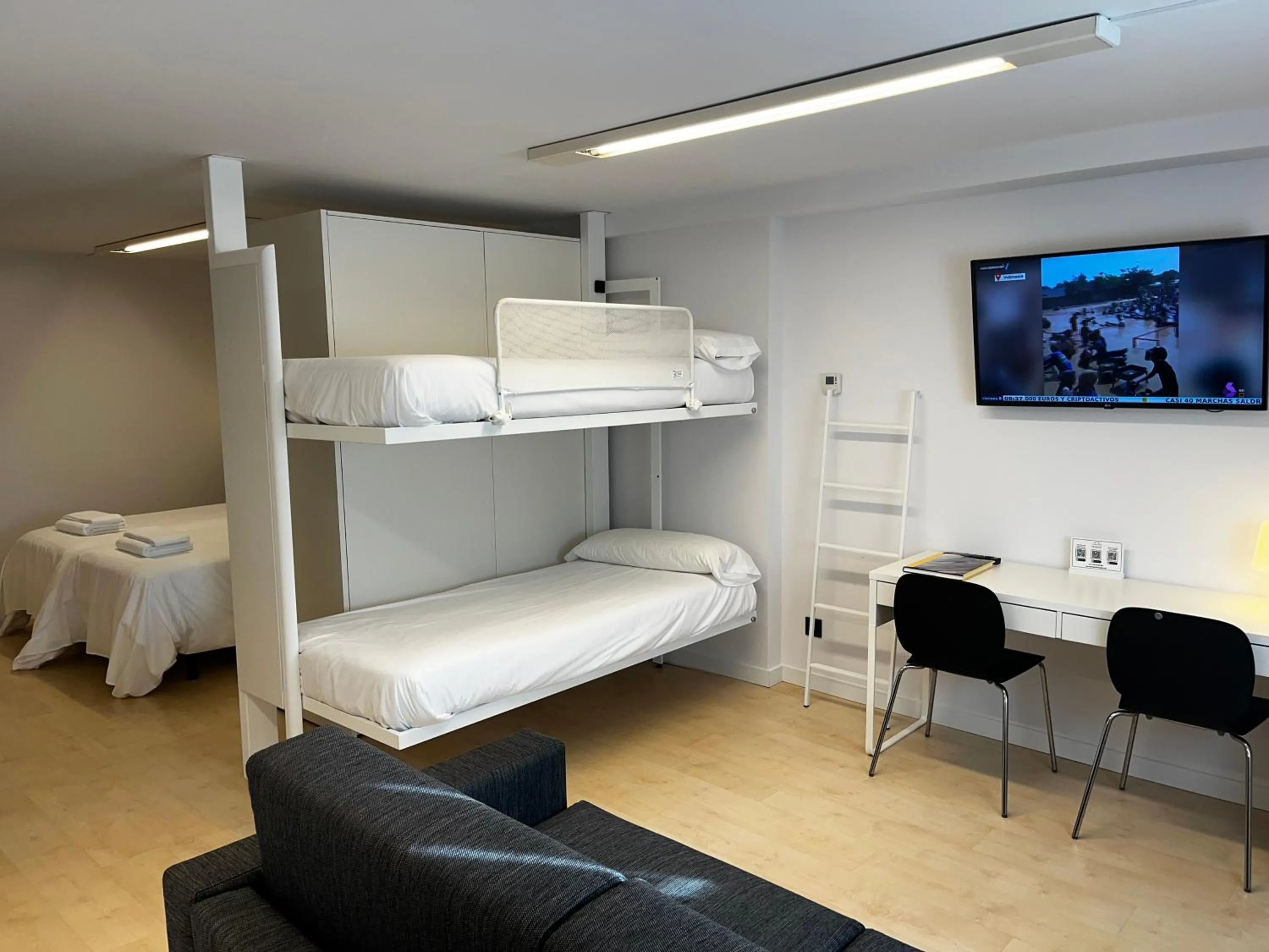 Living room, Bed in Apartamentos Mundaka