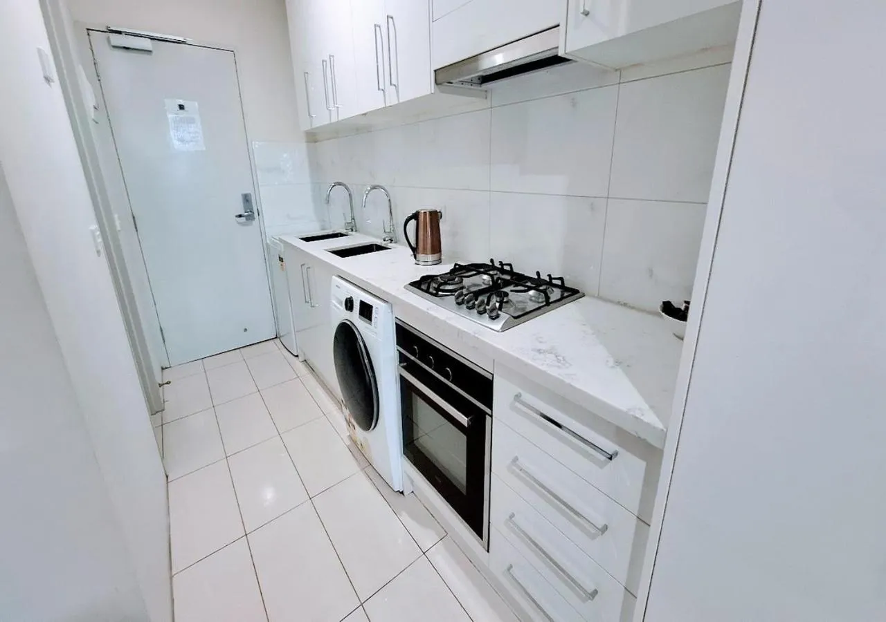 Kitchen or kitchenette in Exodus Dandenong Apartment Hotel