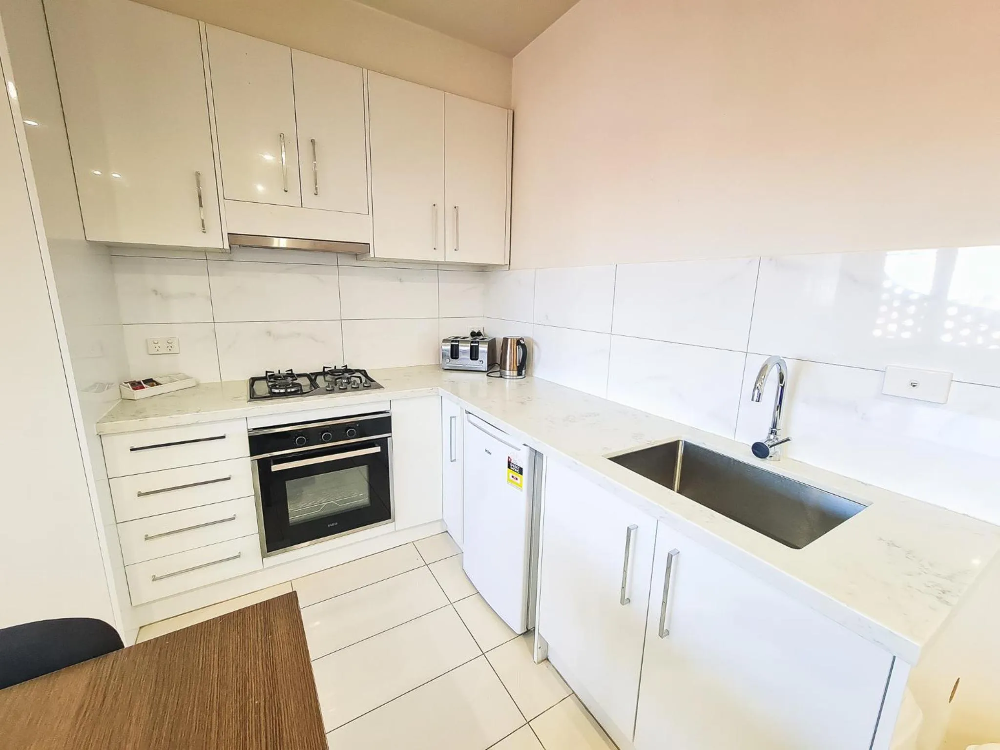 Kitchen or kitchenette in Exodus Dandenong Apartment Hotel