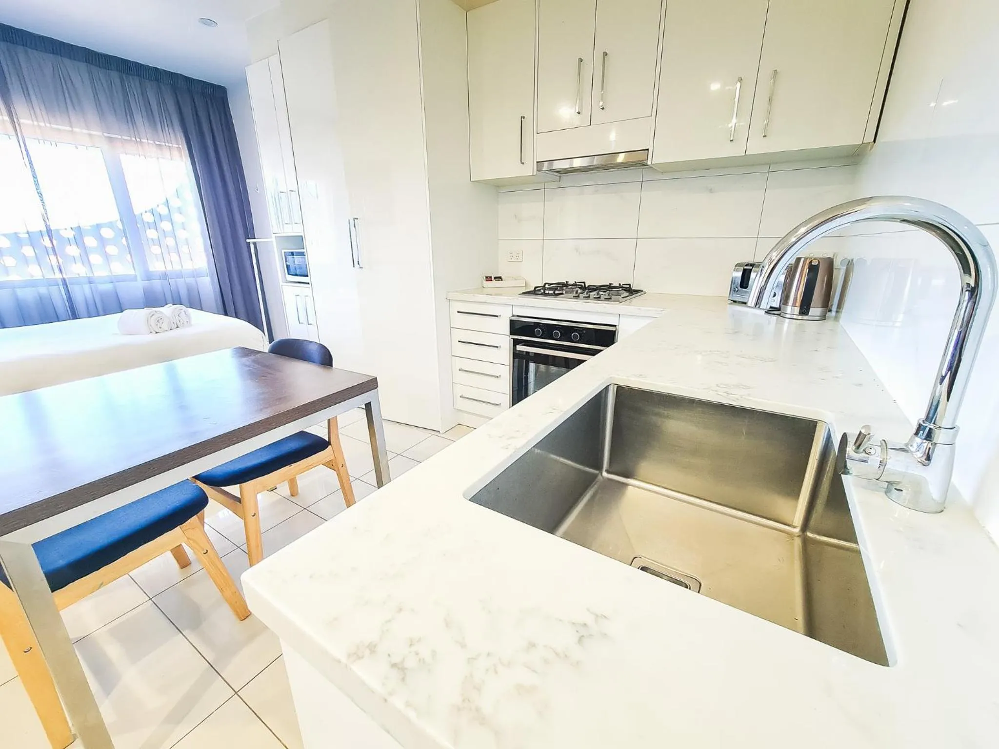 Kitchen or kitchenette in Exodus Dandenong Apartment Hotel