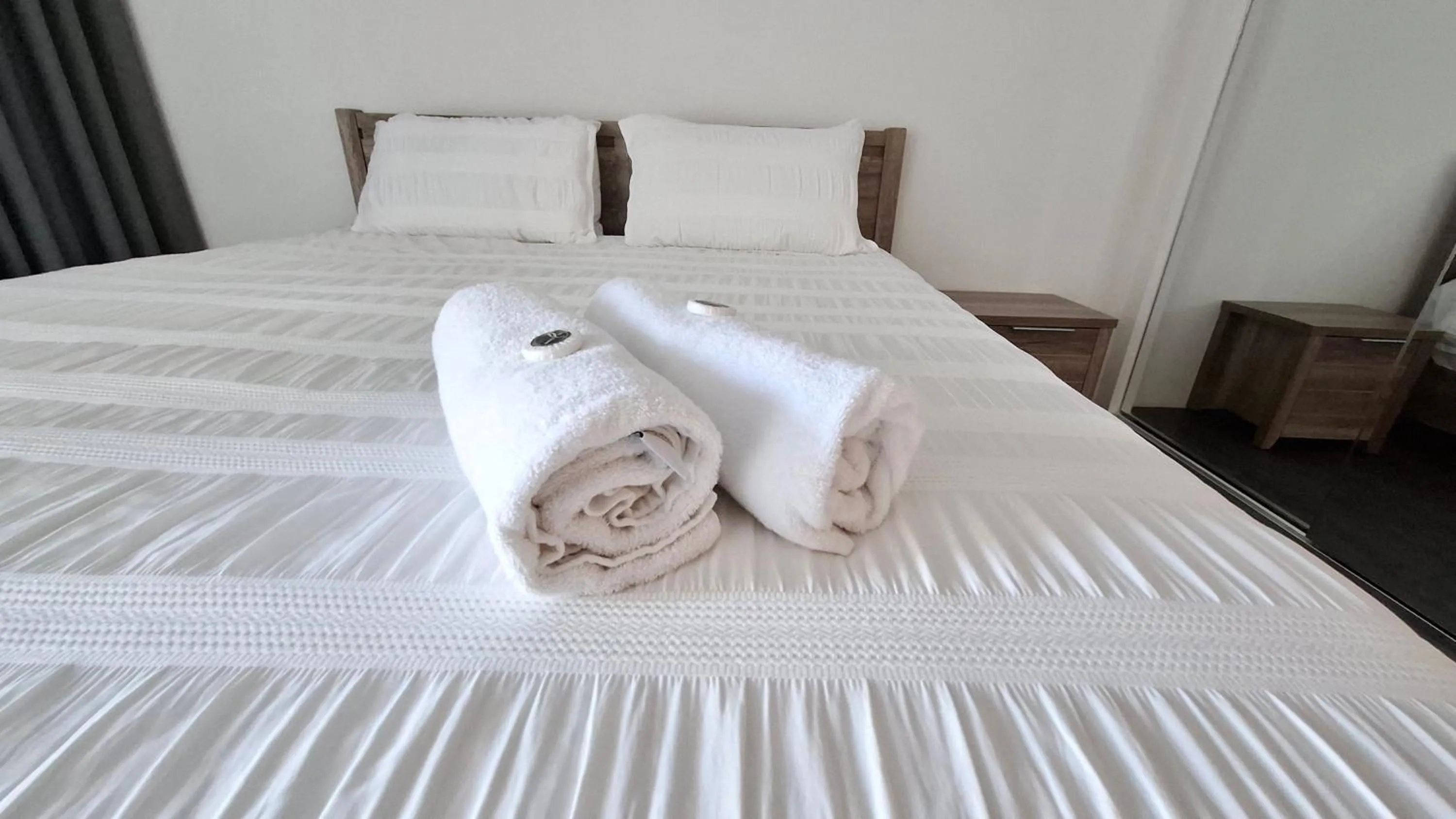 Bed in Exodus Dandenong Apartment Hotel