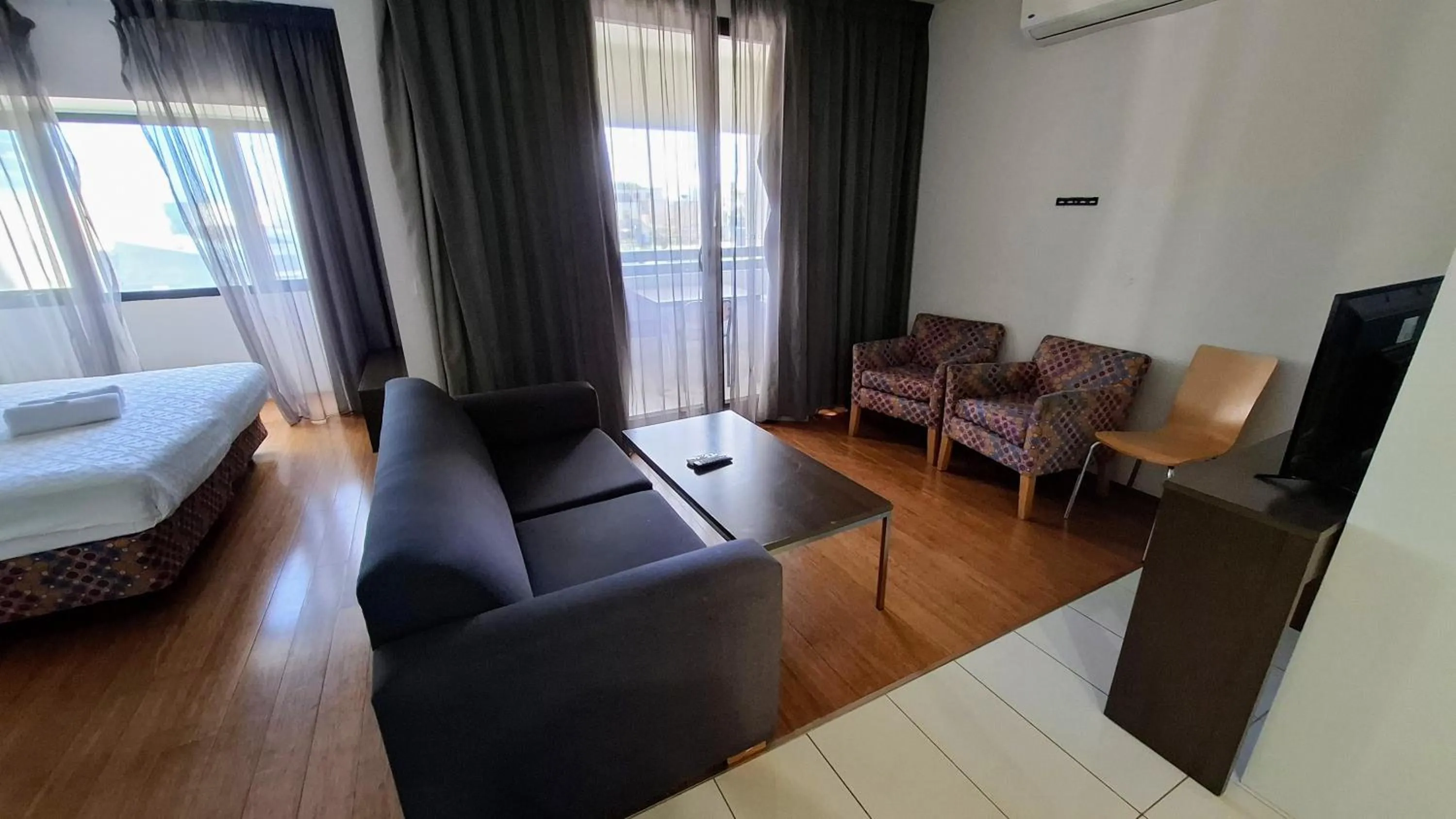 Seating area, Bed in Exodus Dandenong Apartment Hotel