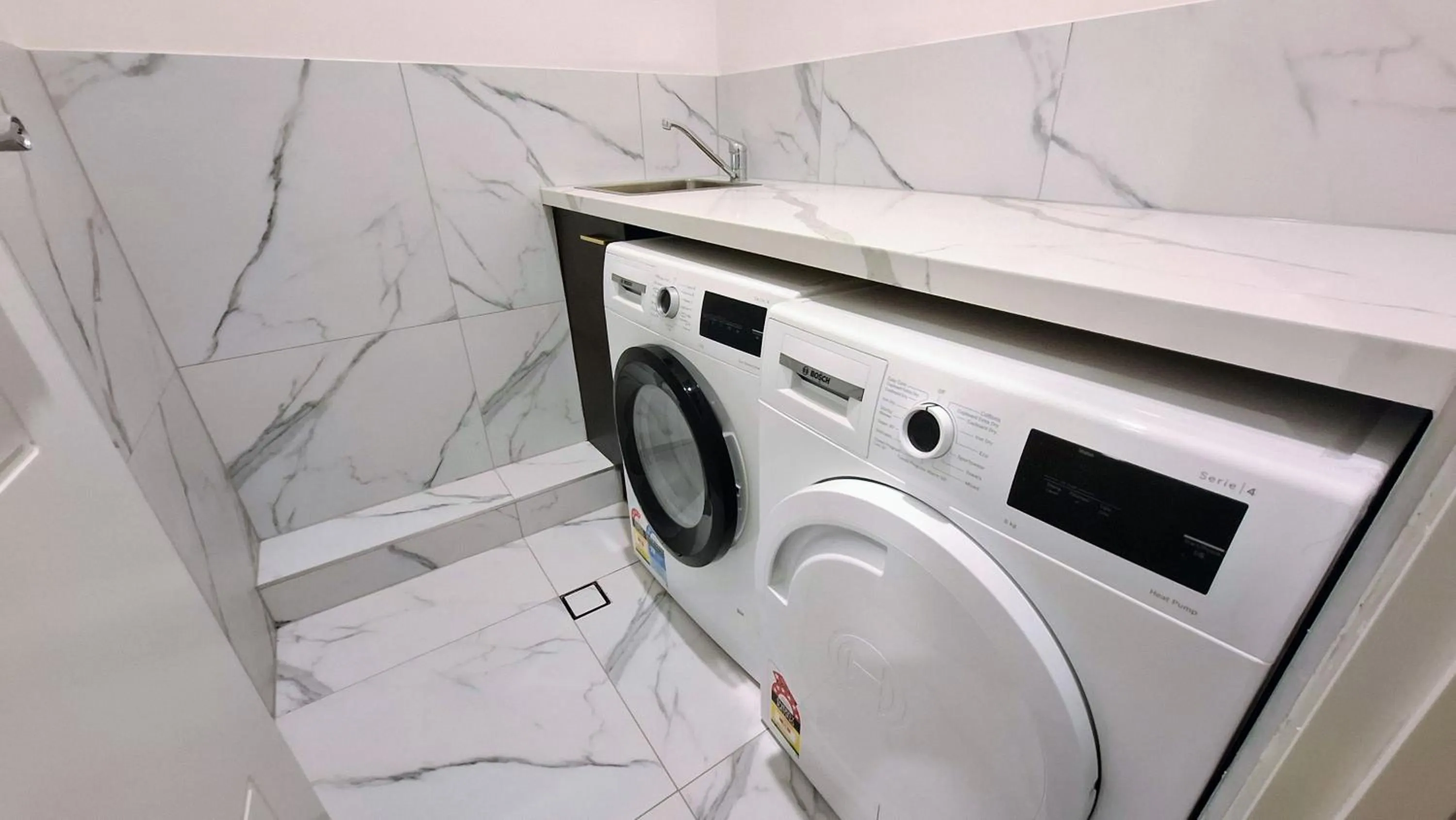 washing machine in Exodus Dandenong Apartment Hotel