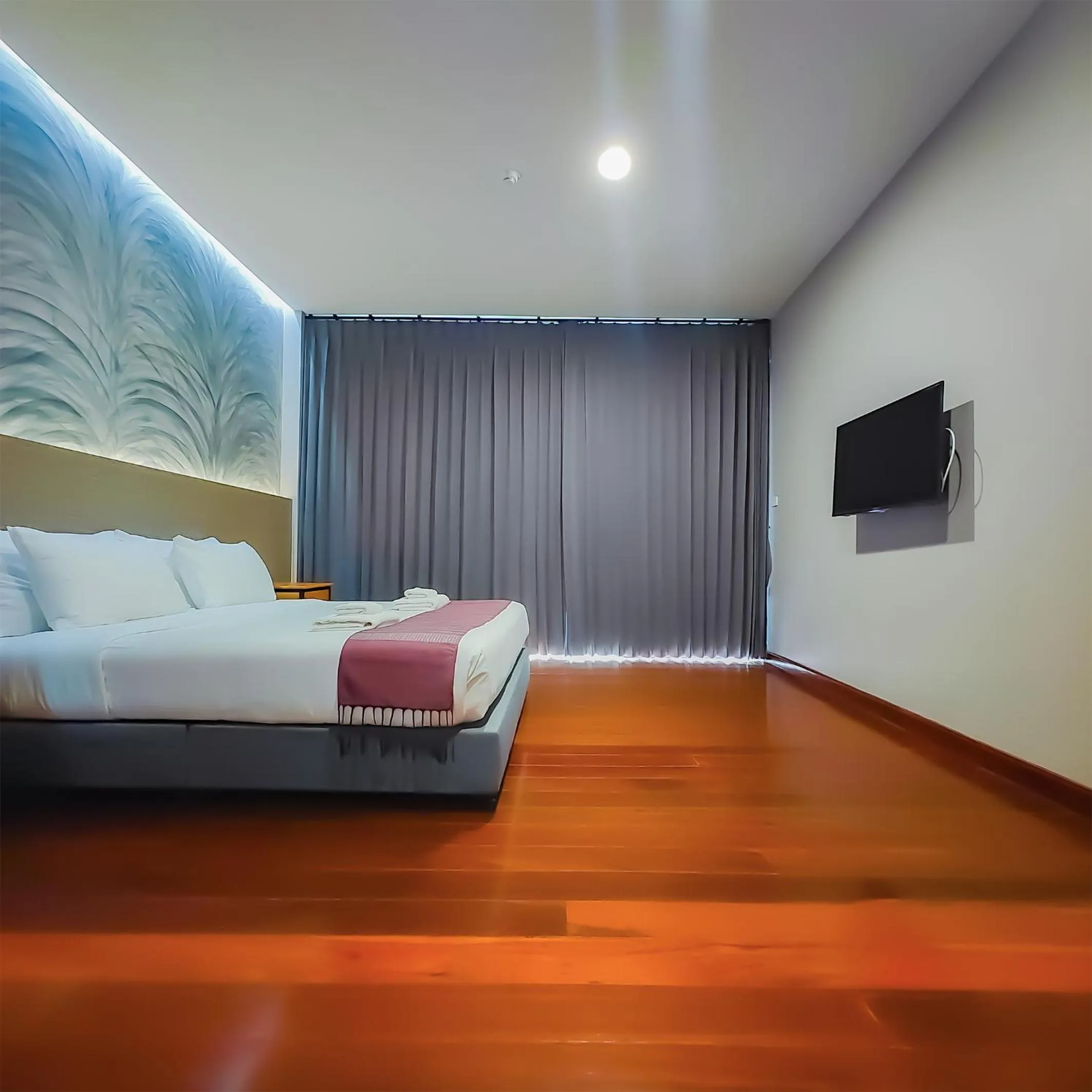 Bed in The Riva Vientiane Hotel